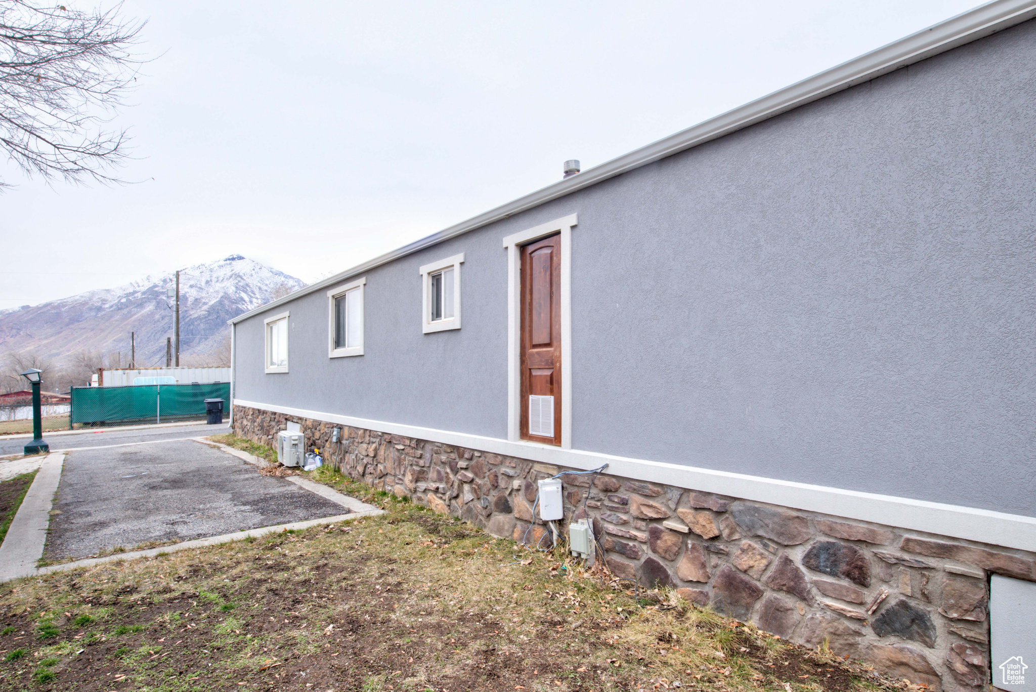 View of side of home featuring a mountain view