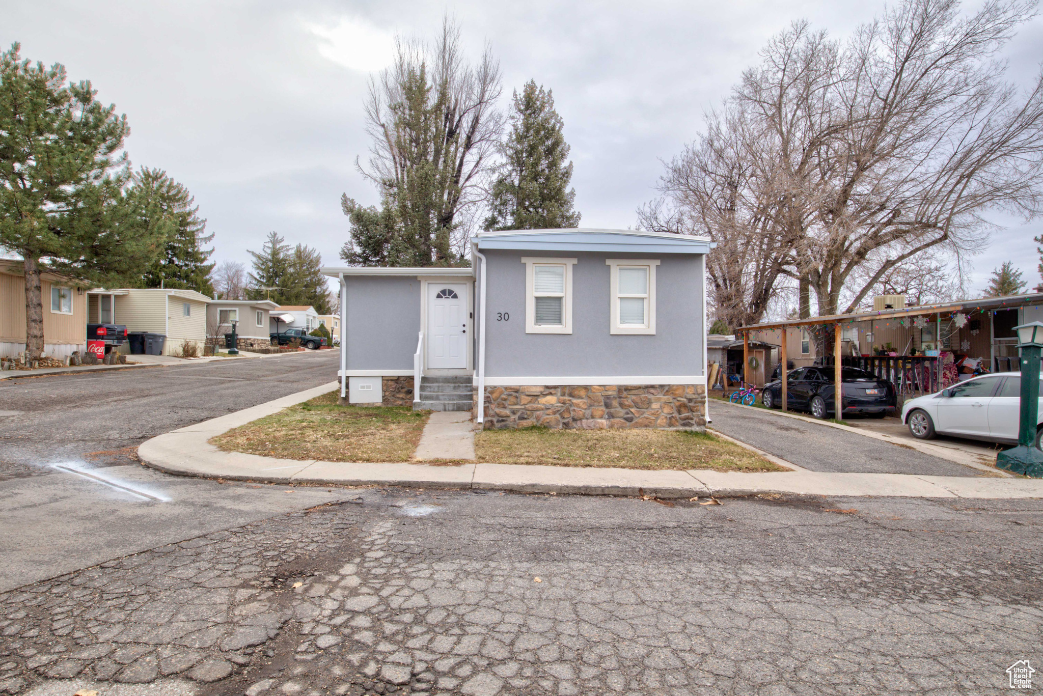 View of front of property featuring a carport