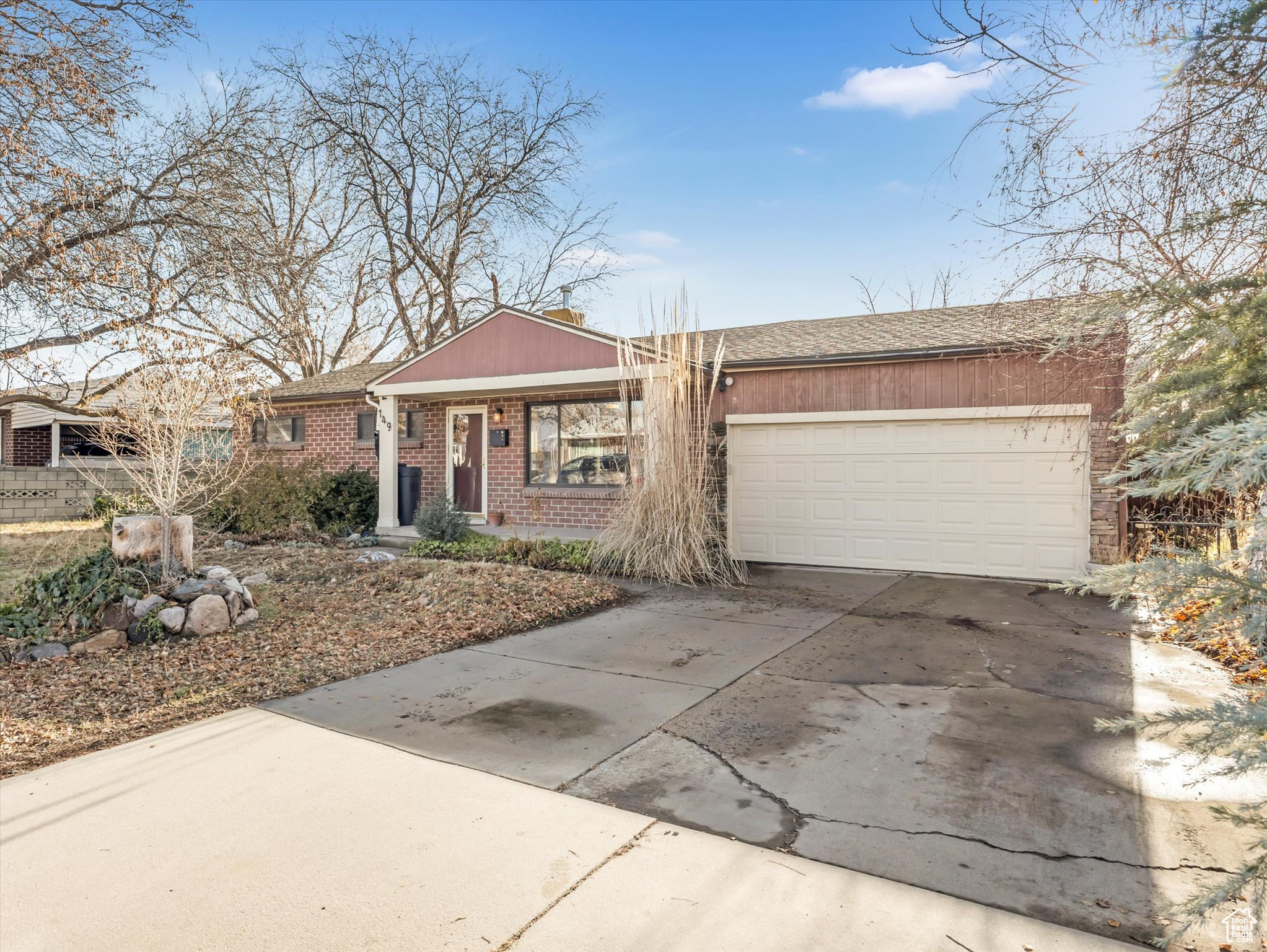 Ranch-style house featuring a garage