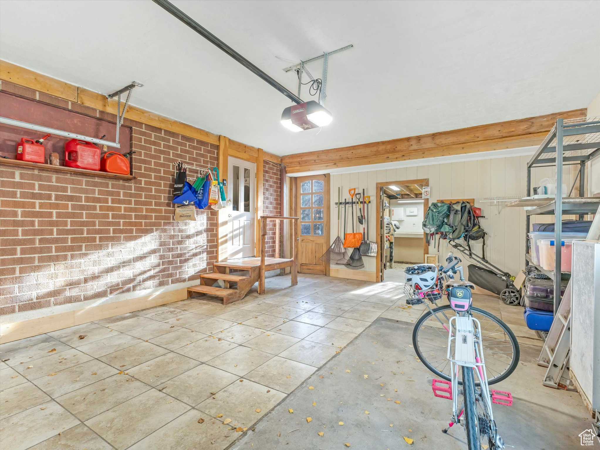 Garage featuring a garage door opener