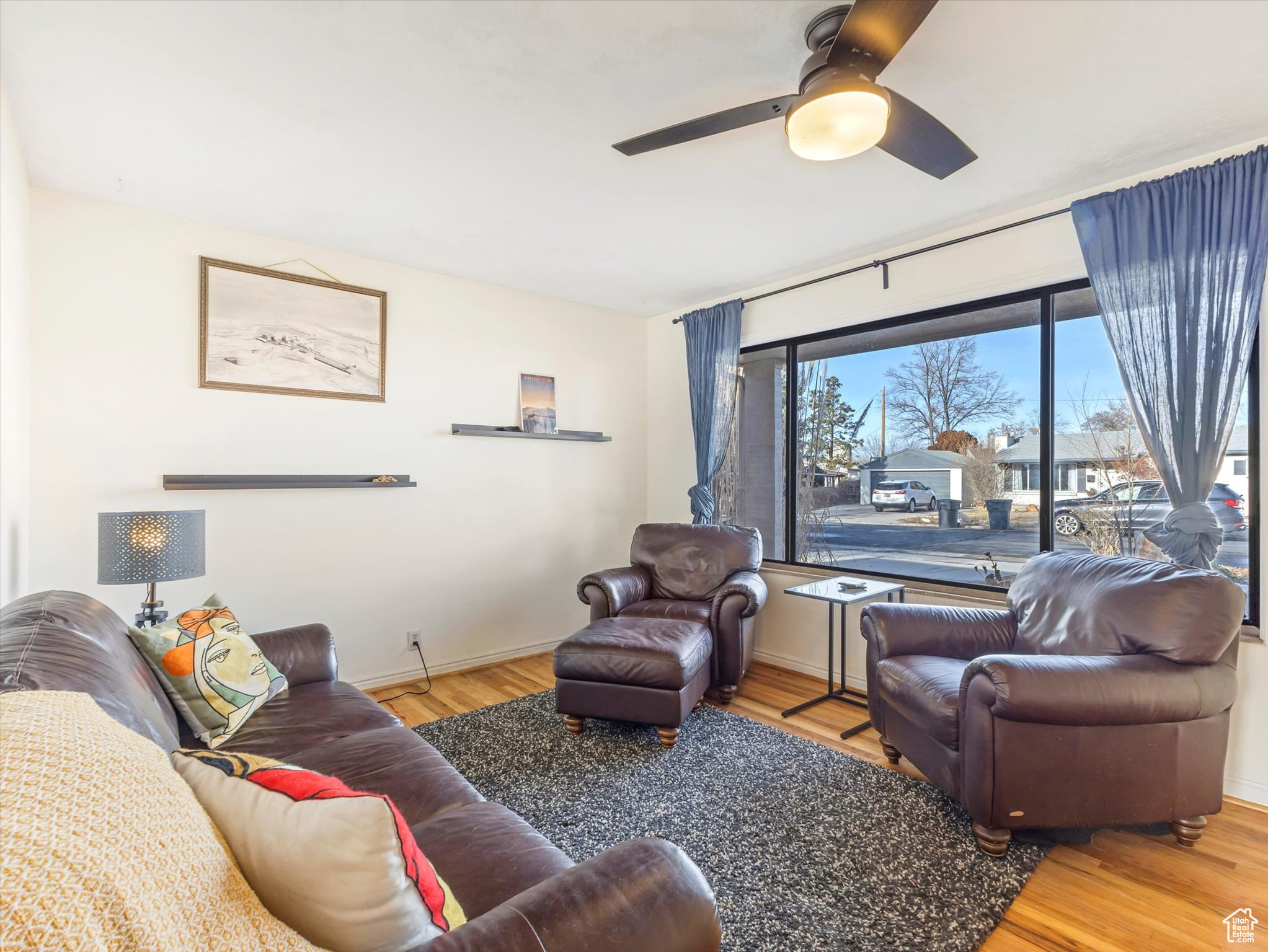 Living room featuring hardwood flooring and ceiling fan