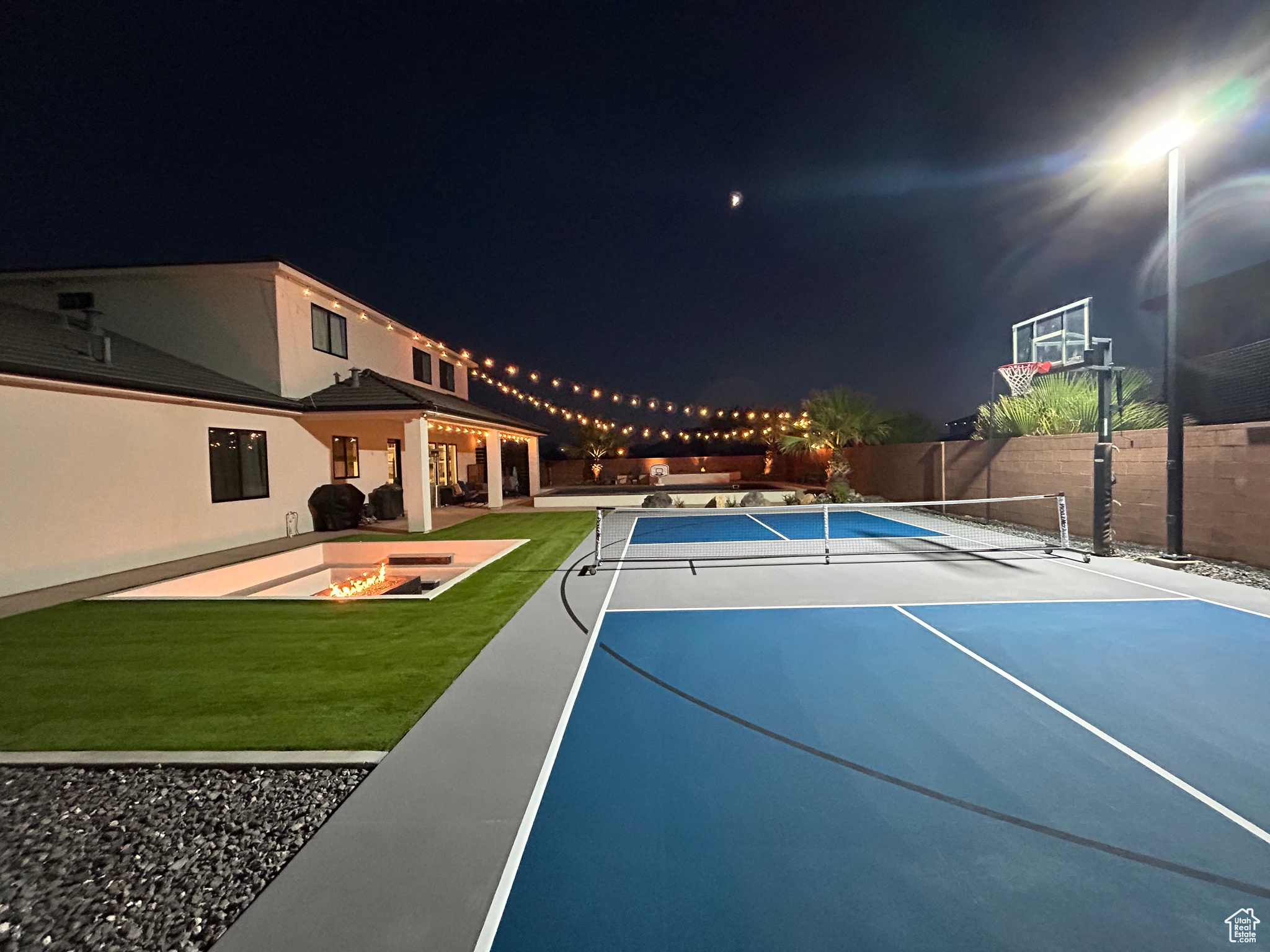 View of sport court with a yard and tennis court