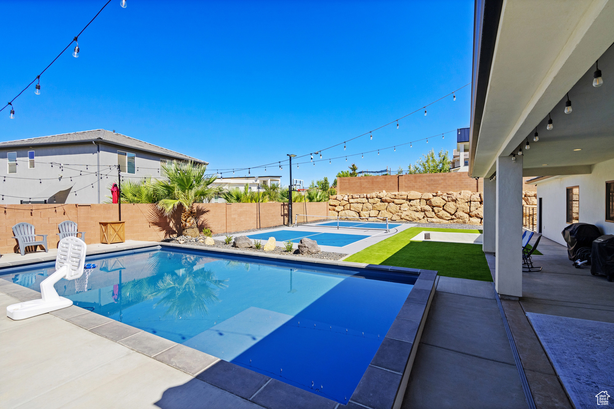 View of swimming pool with a patio area