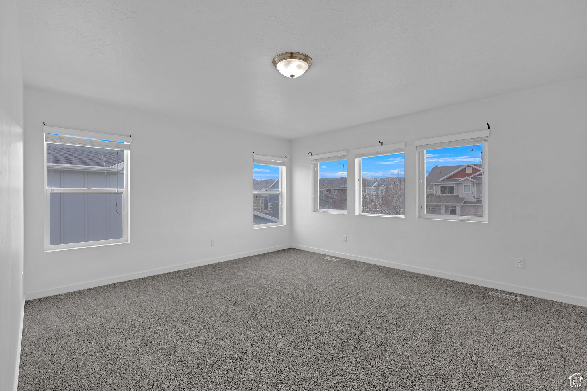 View of carpeted spare room