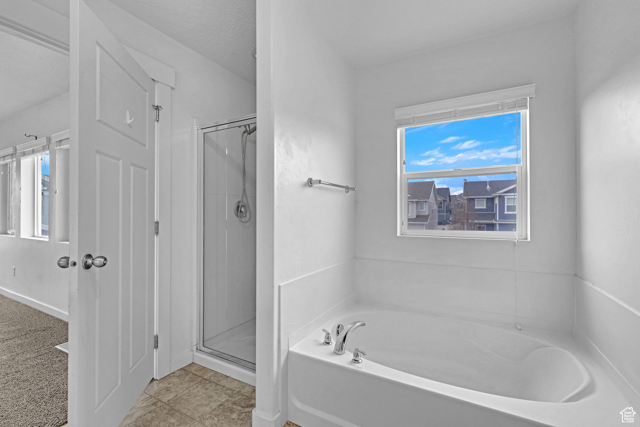 Bathroom featuring independent shower and bath