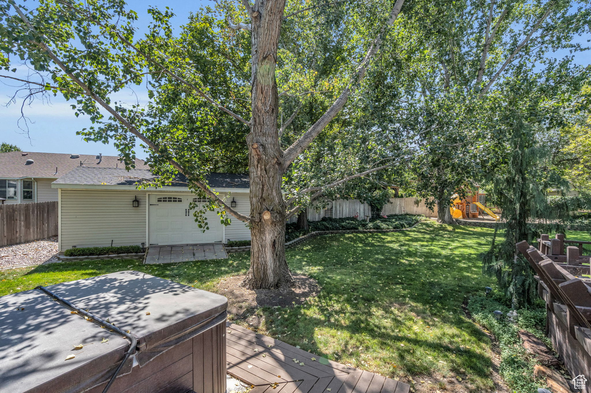 View of yard with a hot tub