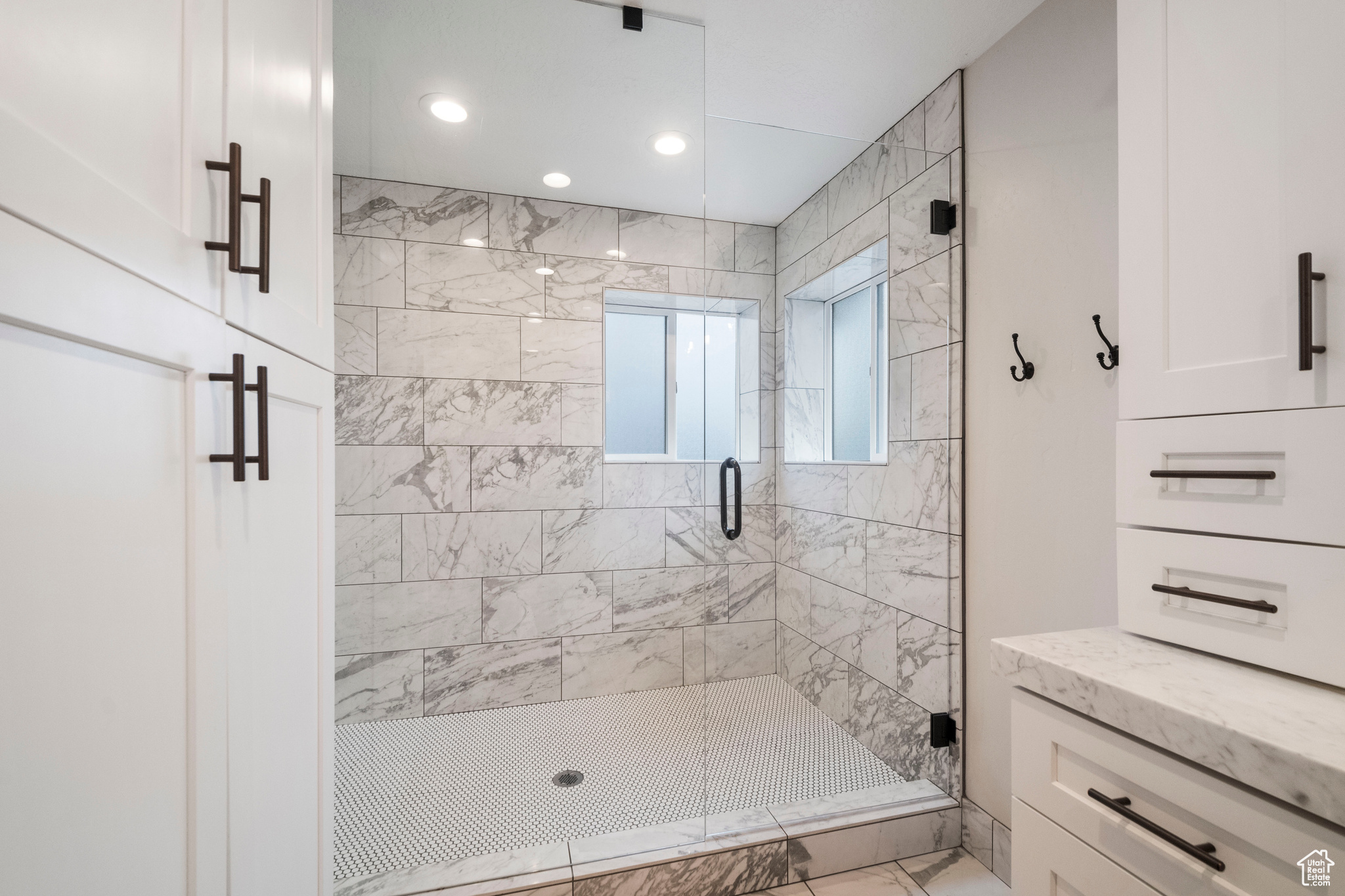 Bathroom featuring a shower with door