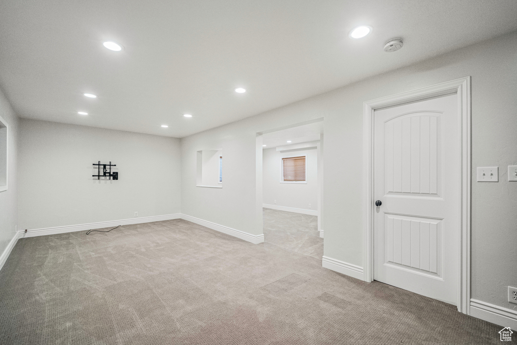 Spare room featuring light colored carpet