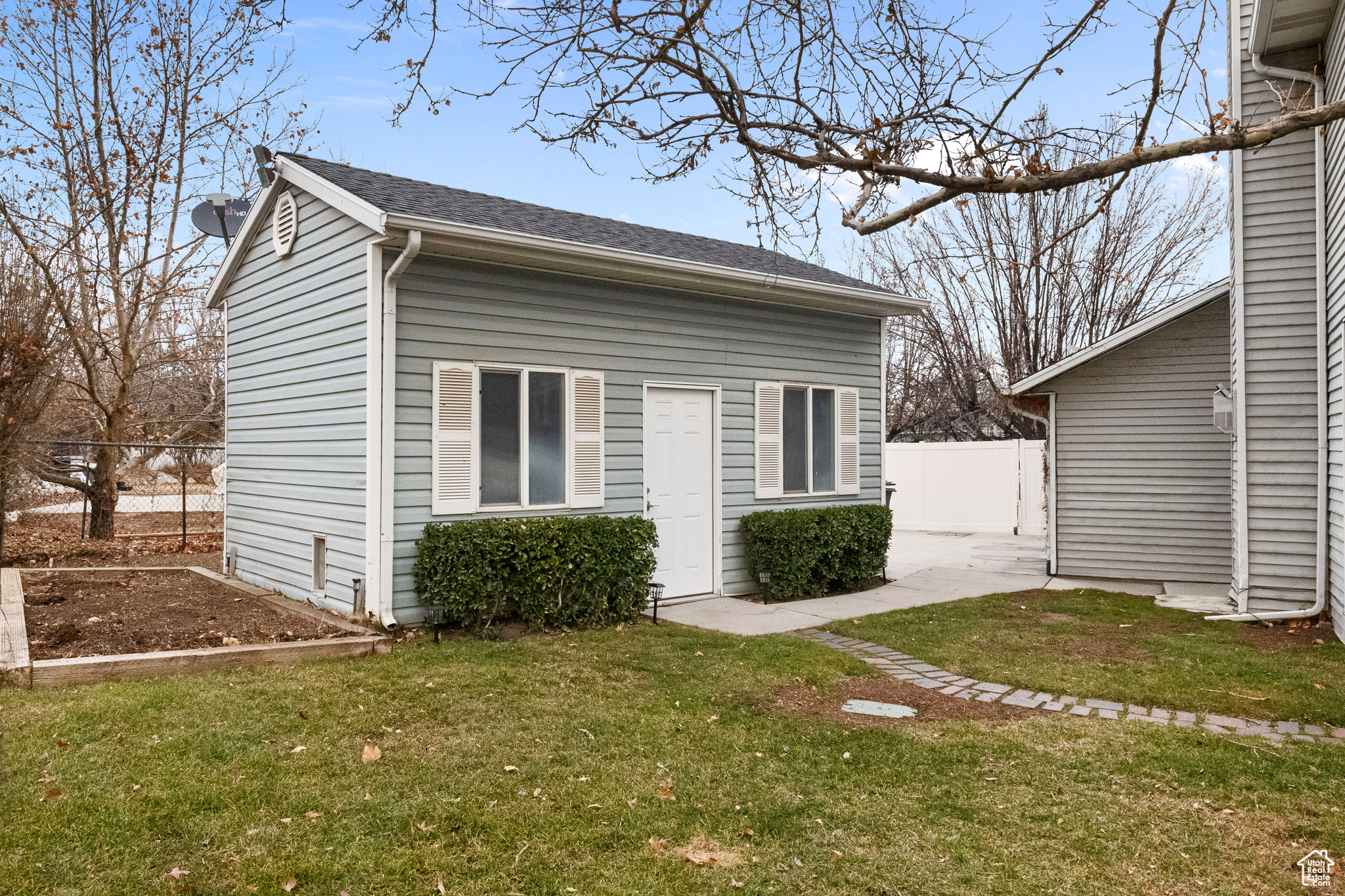 View of property exterior with a yard