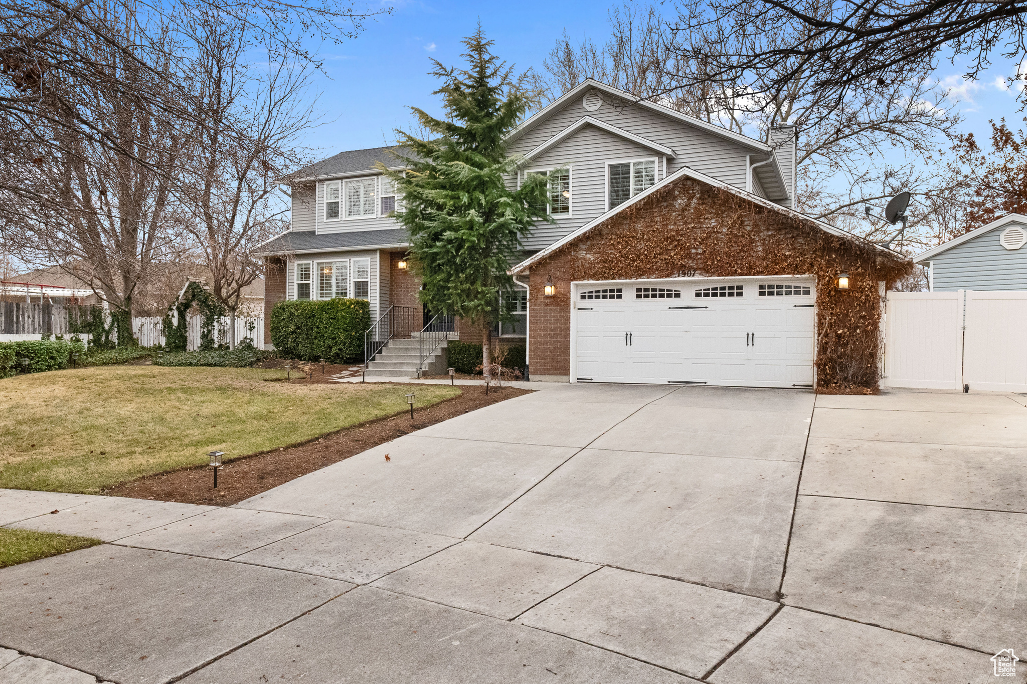 View of property with a front yard