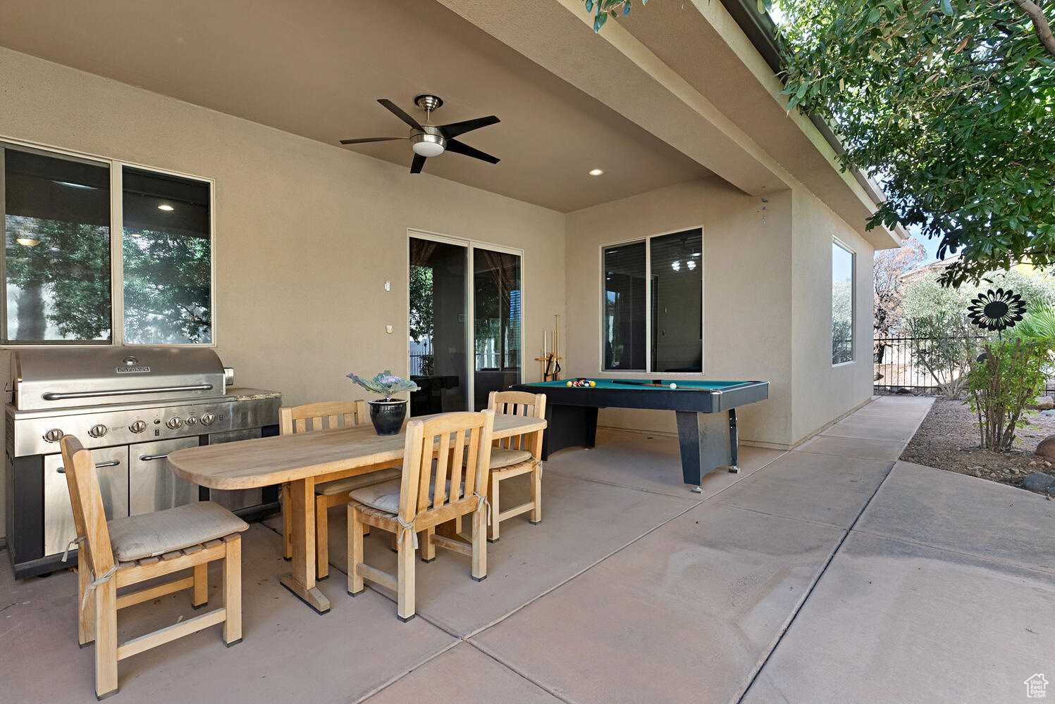 View of patio / terrace with ceiling fan and a grill