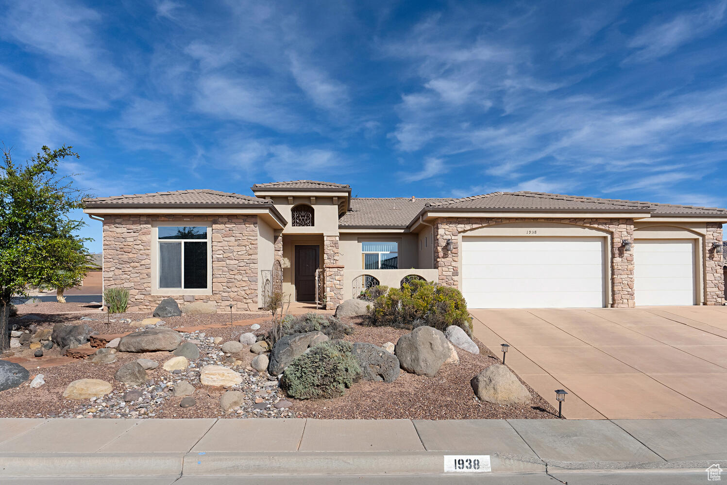 View of front of property with a garage