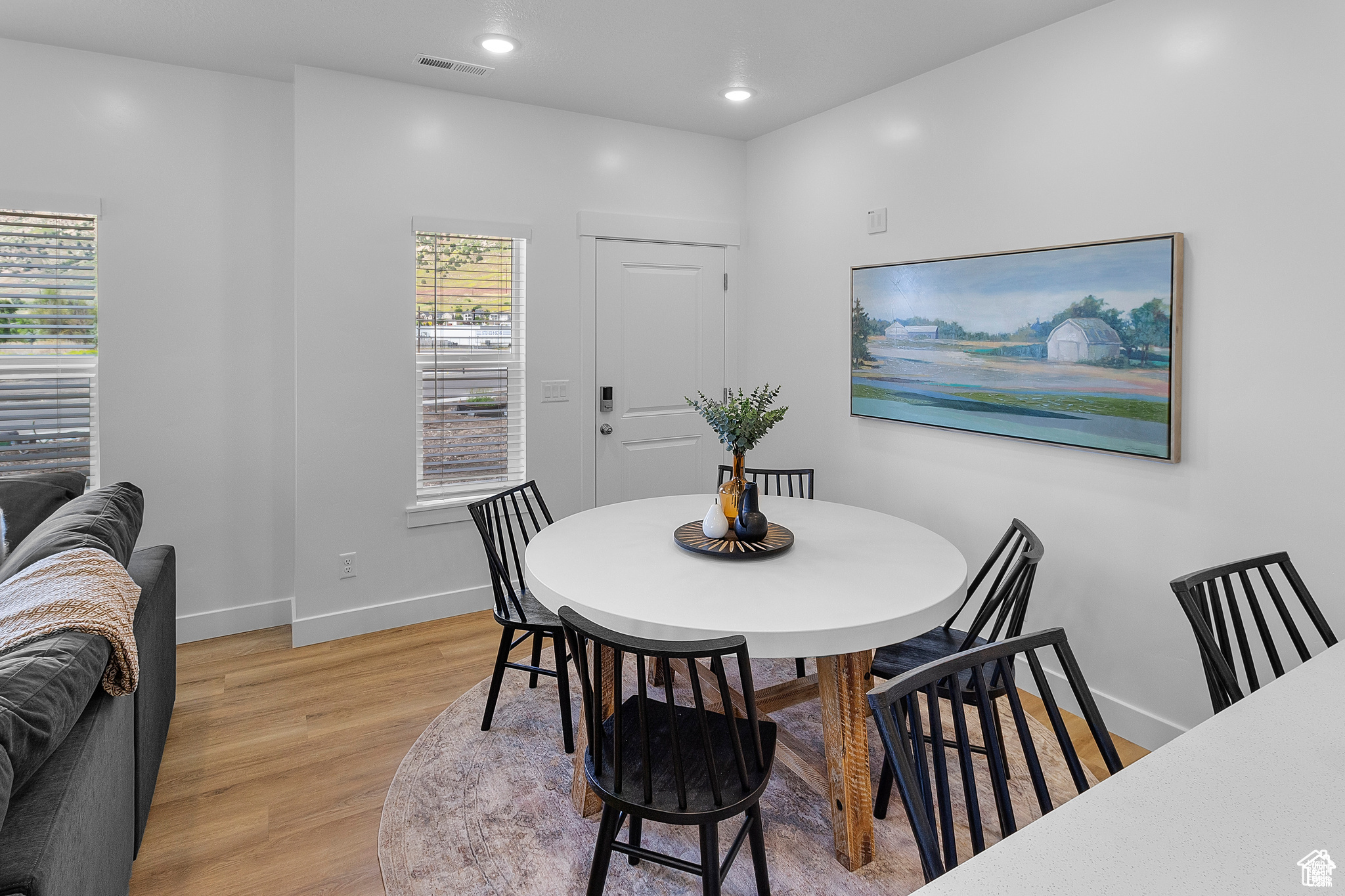 Dining area with light wood-type flooring