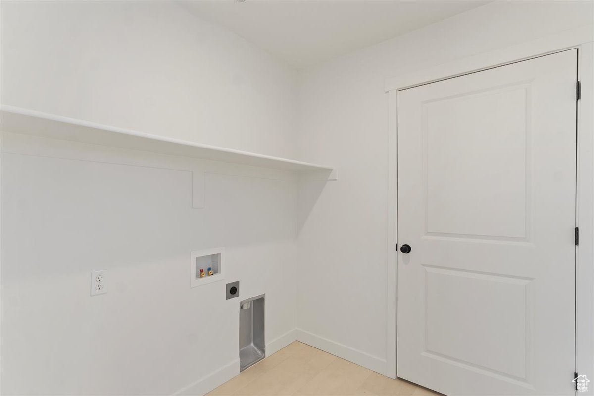 Laundry area with hookup for an electric dryer and hookup for a washing machine