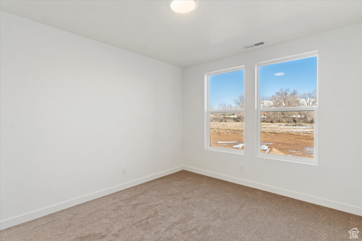 Empty room featuring carpet flooring