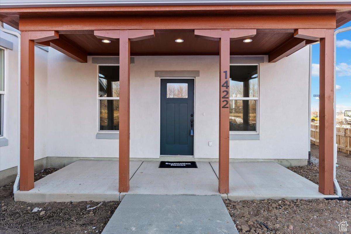 Property entrance featuring a patio area