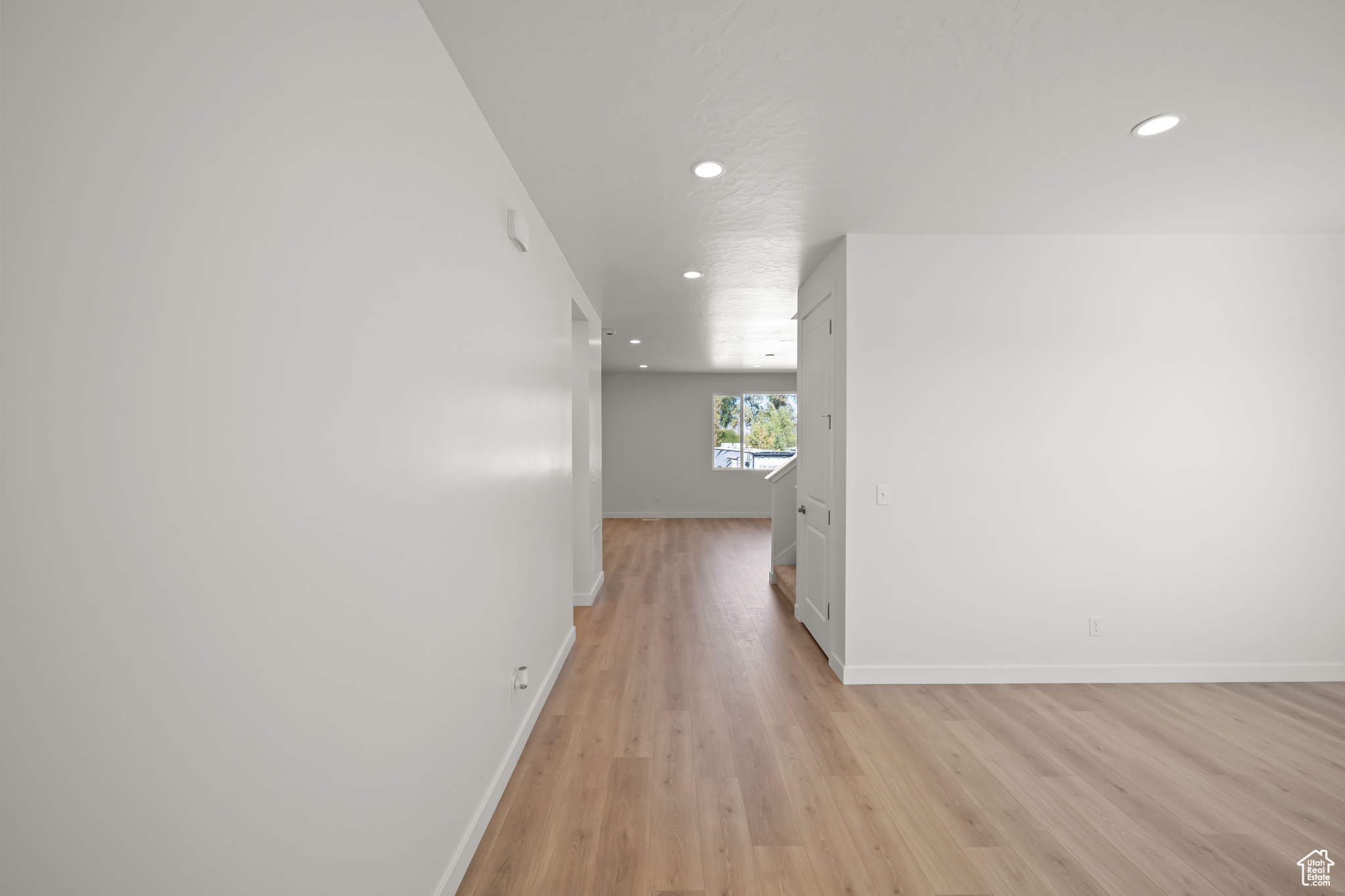 Hallway featuring light wood-type flooring