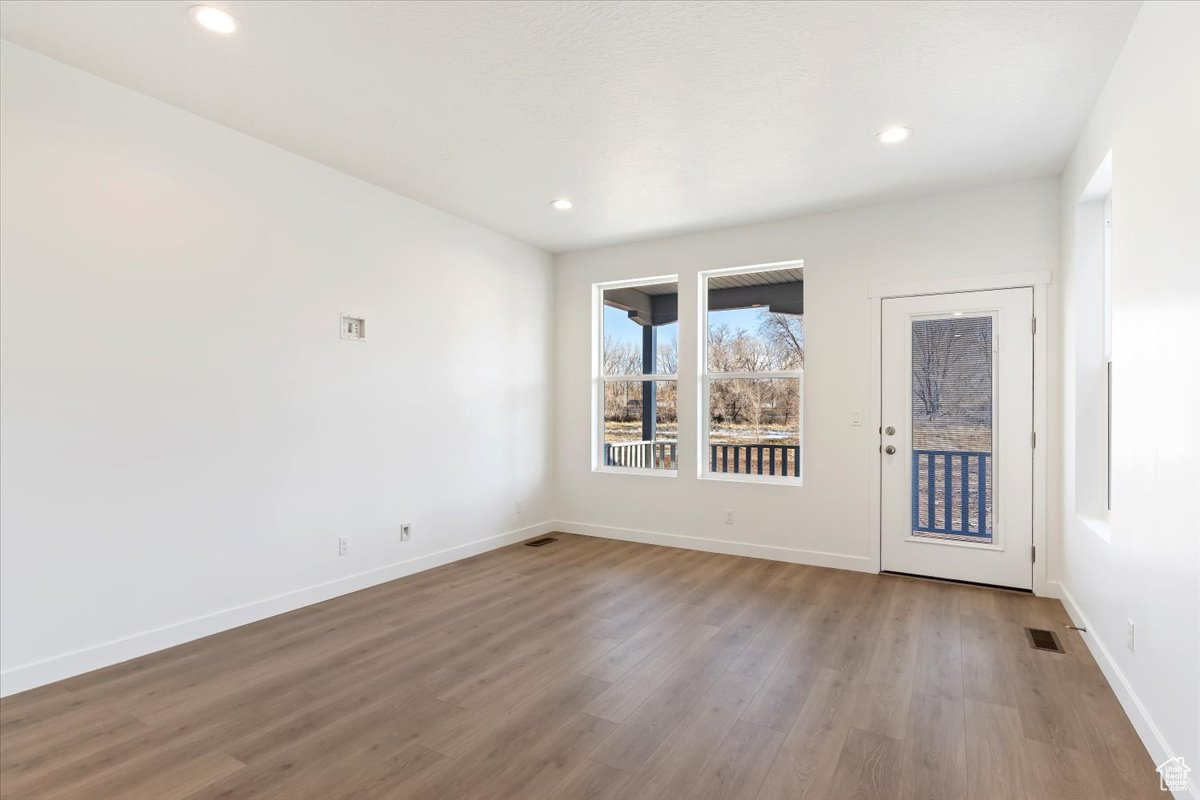 Spare room with light hardwood / wood-style flooring