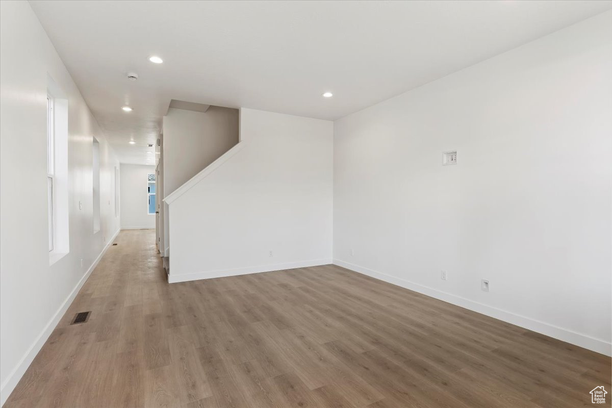 Unfurnished room with hardwood / wood-style flooring