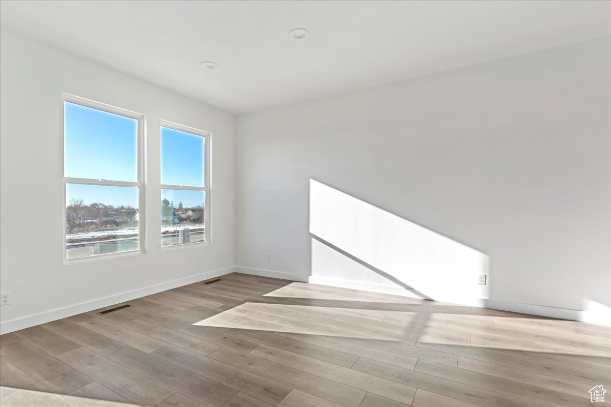 Spare room featuring light hardwood / wood-style floors