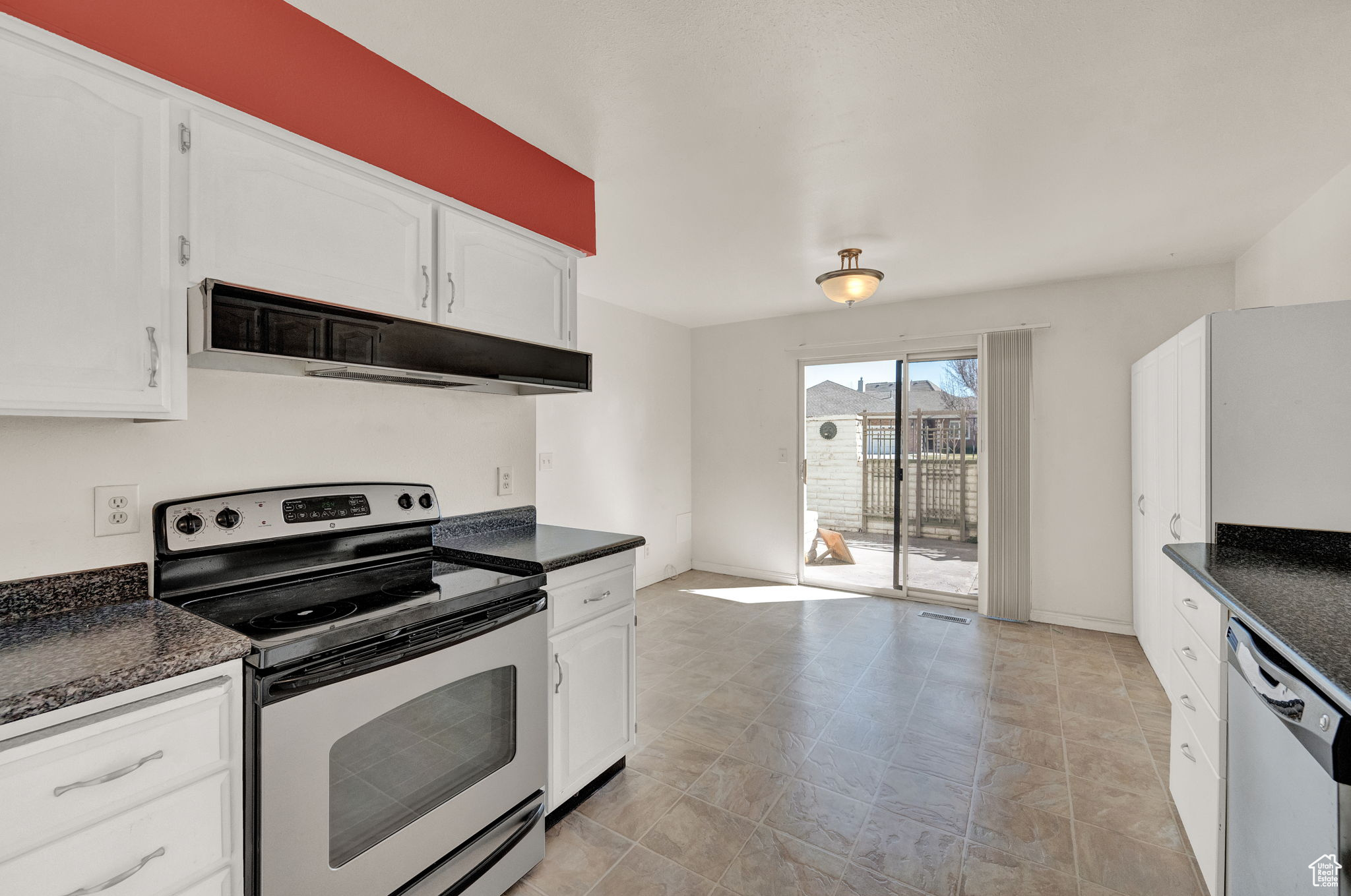 Kitchen with white cabinets and stainless steel appliances