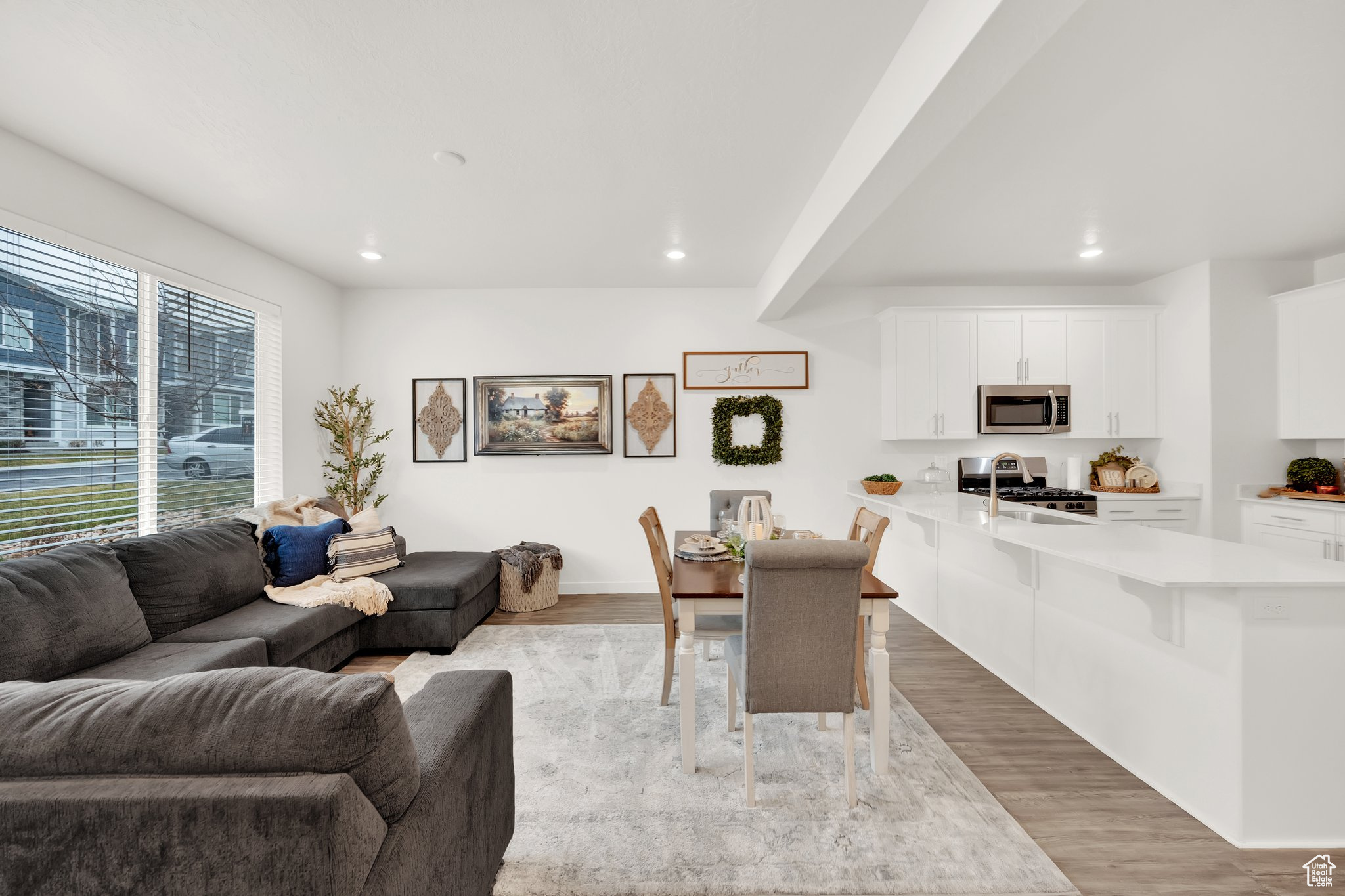 Living room featuring light wood-type flooring and sink