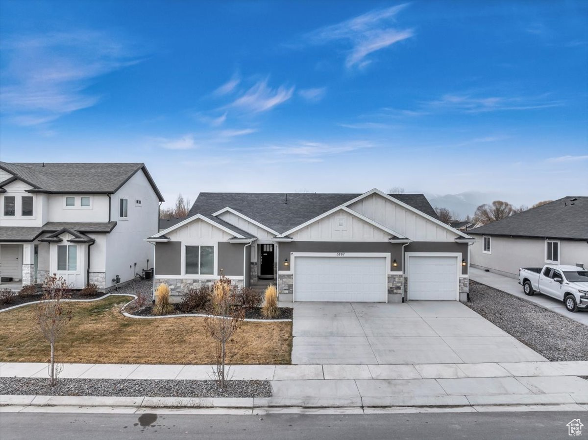 View of front of property featuring a garage