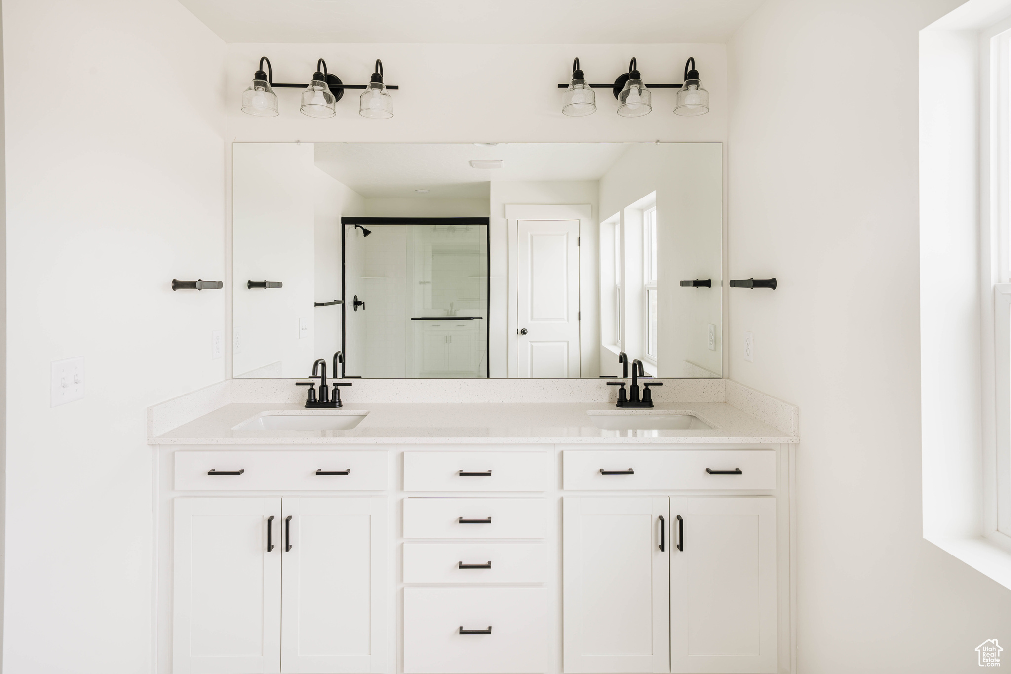 Bathroom featuring vanity and walk in shower