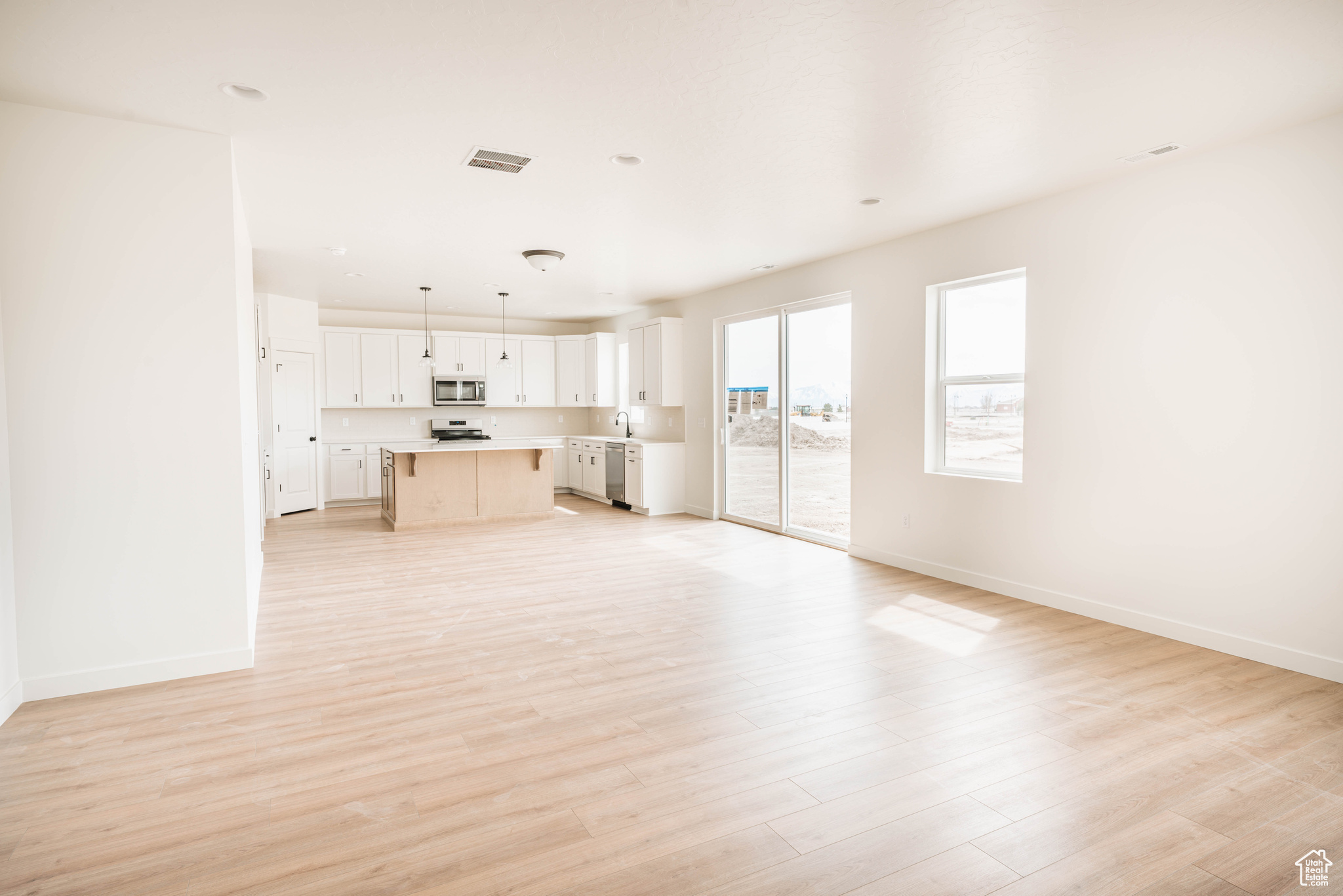 Unfurnished living room with light wood-type flooring