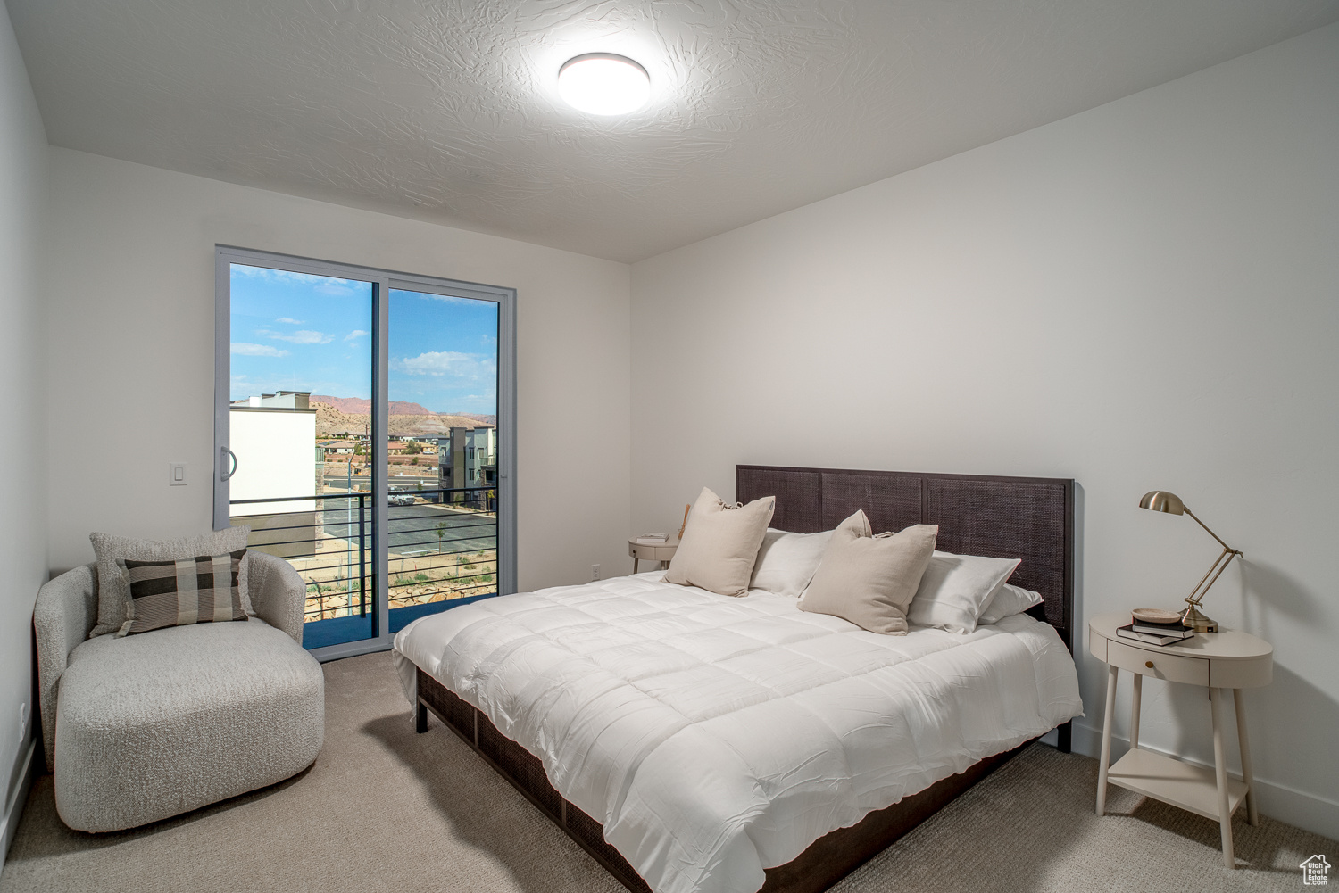 Bedroom with access to exterior deck with views of Redrock