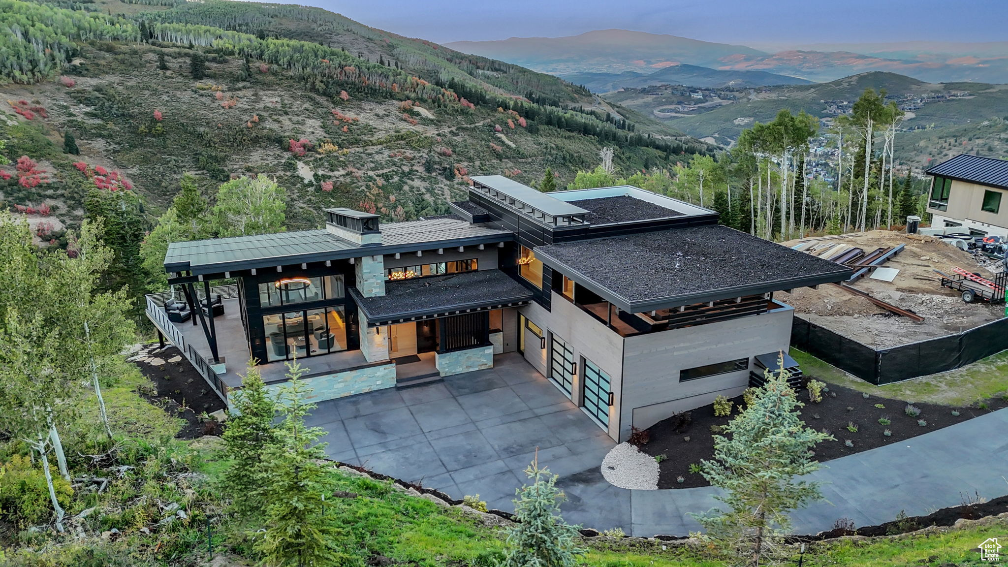 Aerial view at dusk featuring a mountain view