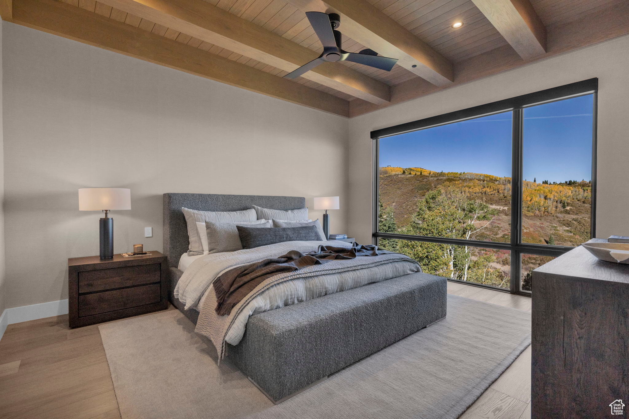 Bedroom with ceiling fan, beamed ceiling, wooden ceiling, and light hardwood / wood-style floors