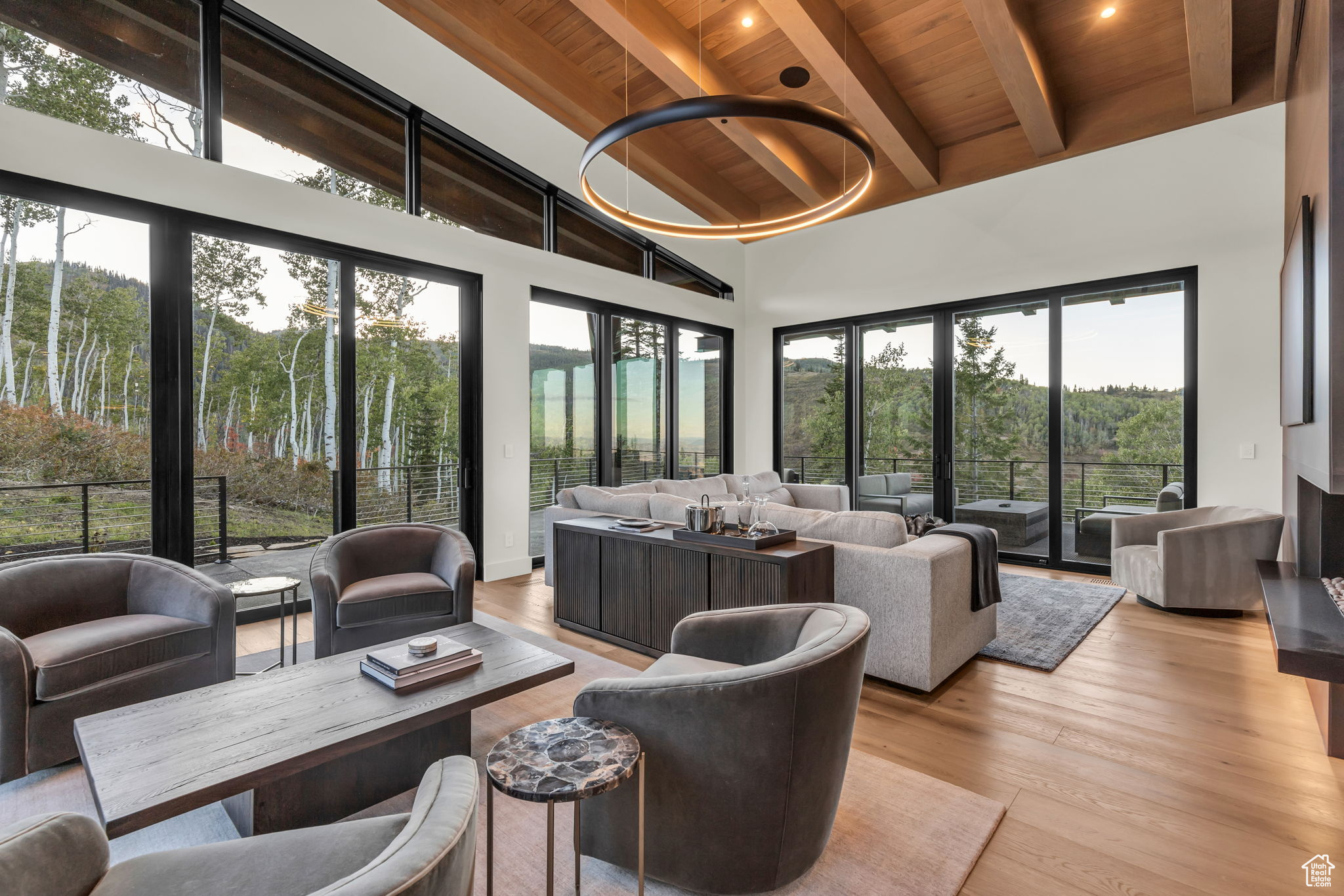 Sunroom featuring vaulted ceiling with beams and wood ceiling