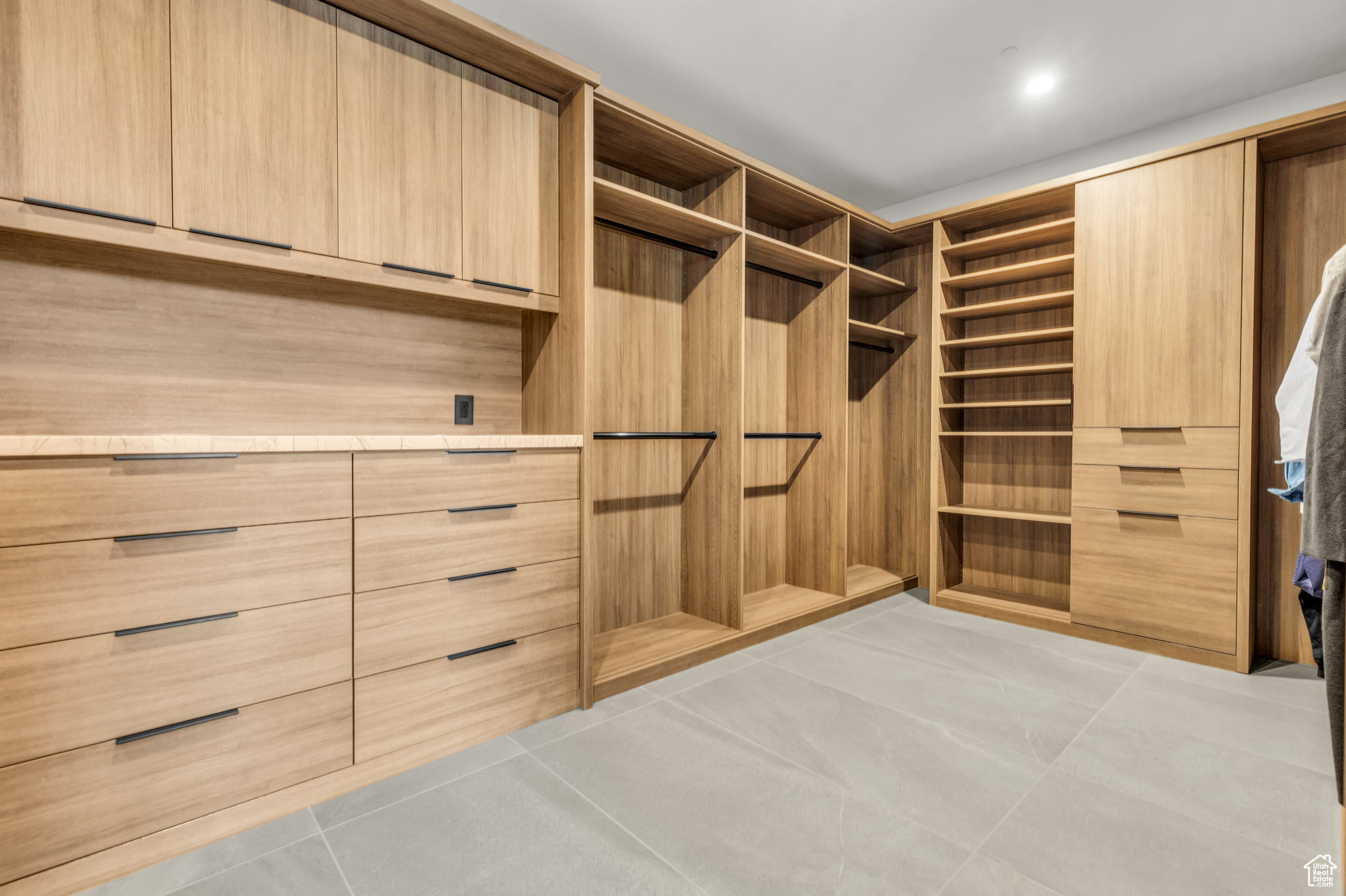 Walk in closet featuring light tile patterned flooring