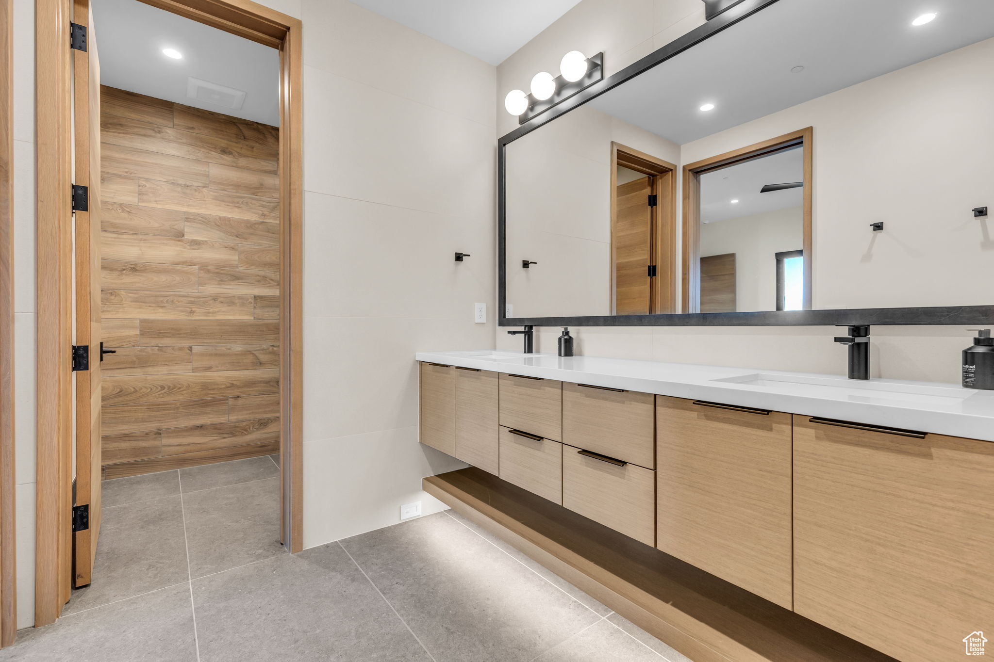 Bathroom with tile patterned flooring and vanity