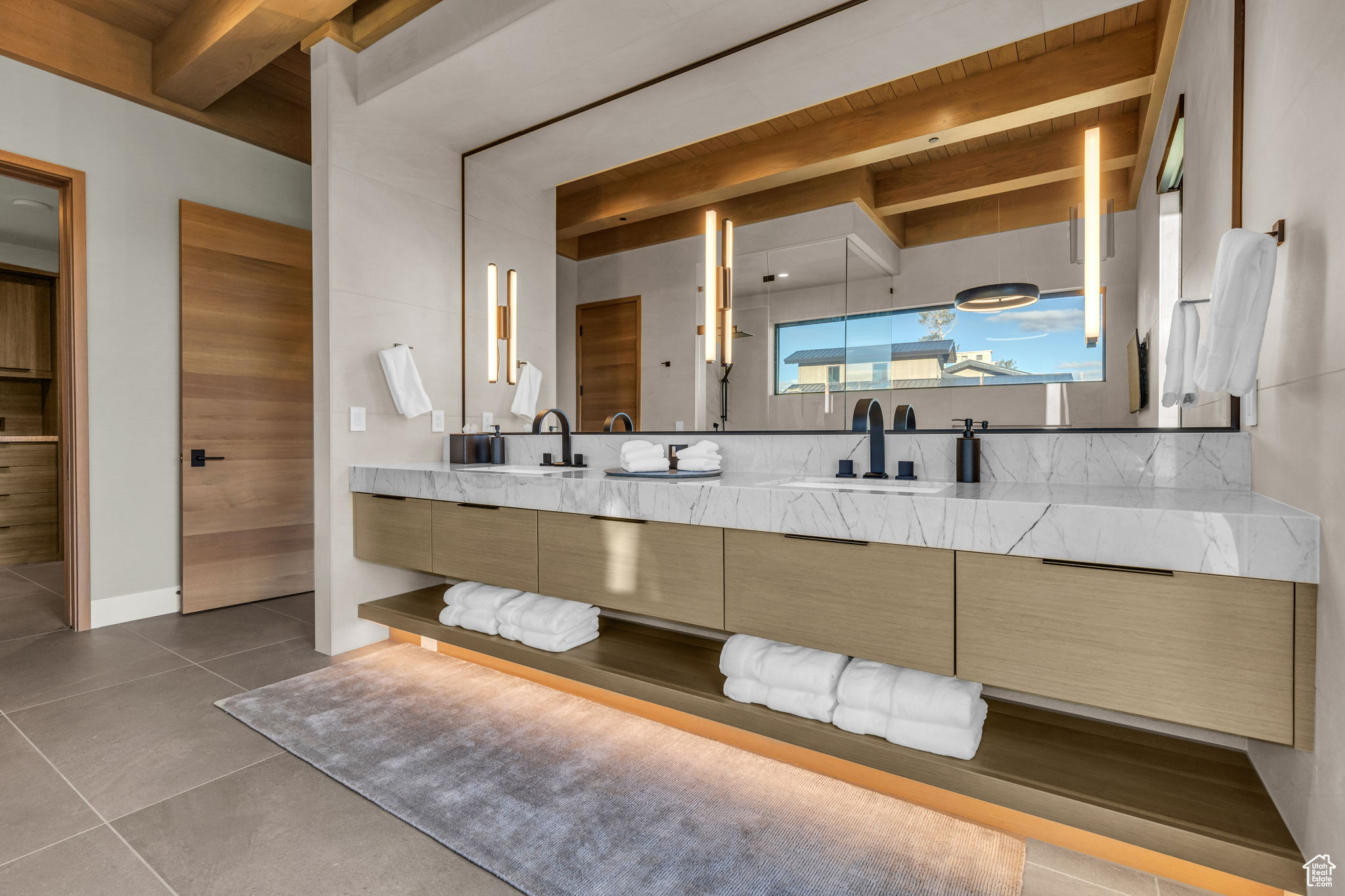 Bathroom featuring beamed ceiling, vanity, and wooden ceiling