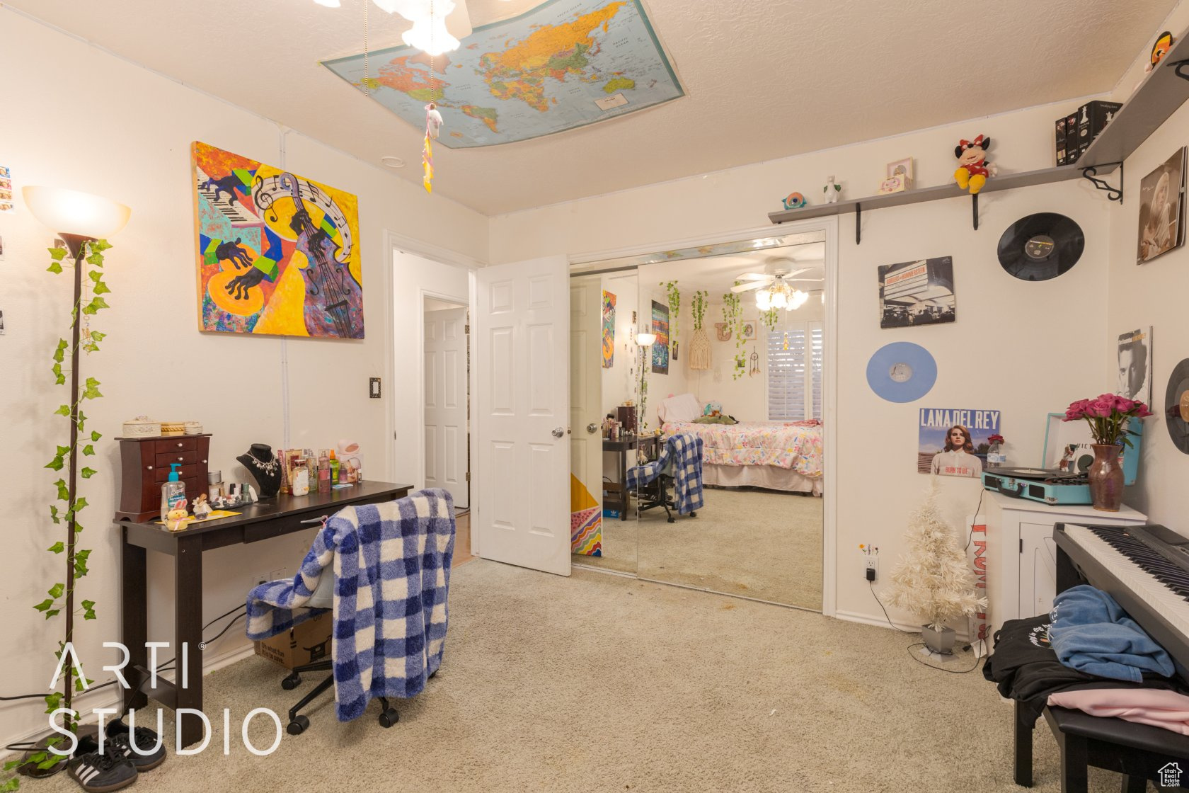 Bedroom featuring a closet and light colored carpet