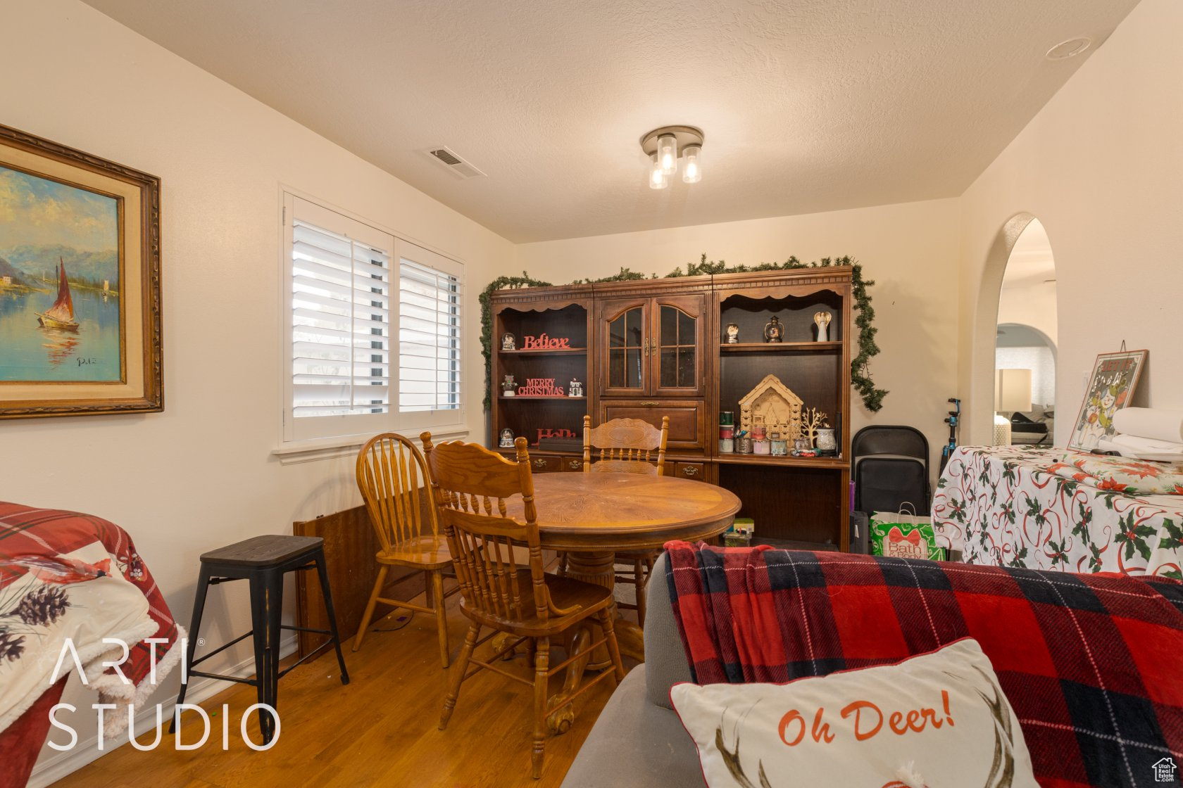 Dining area with hardwood / wood-style flooring