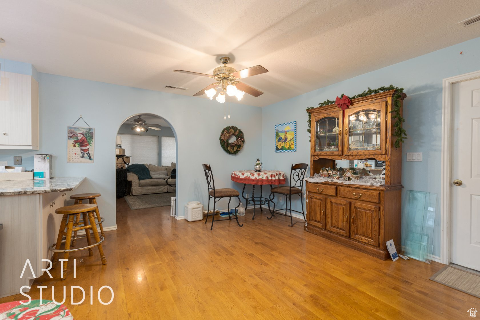 Dining space featuring ceiling fan and light wood-type flooring