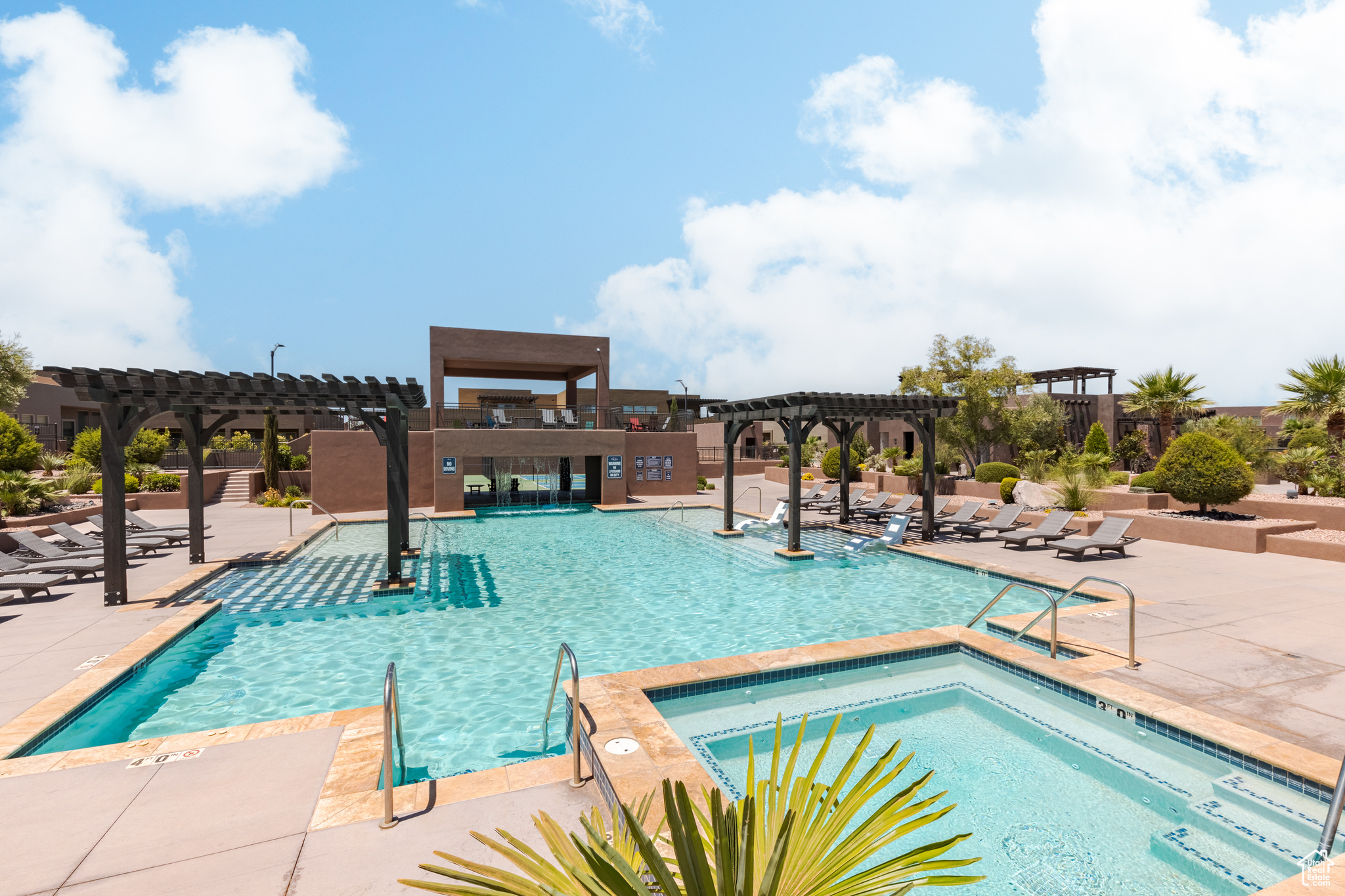 View of swimming pool featuring a pergola, a patio, and a hot tub