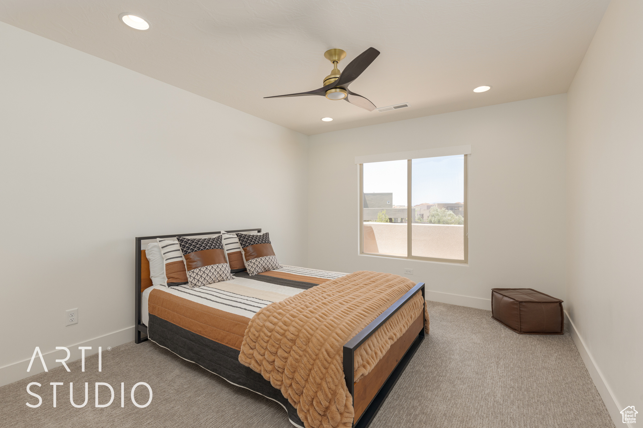 Bedroom #3 with light colored carpet and ceiling fan