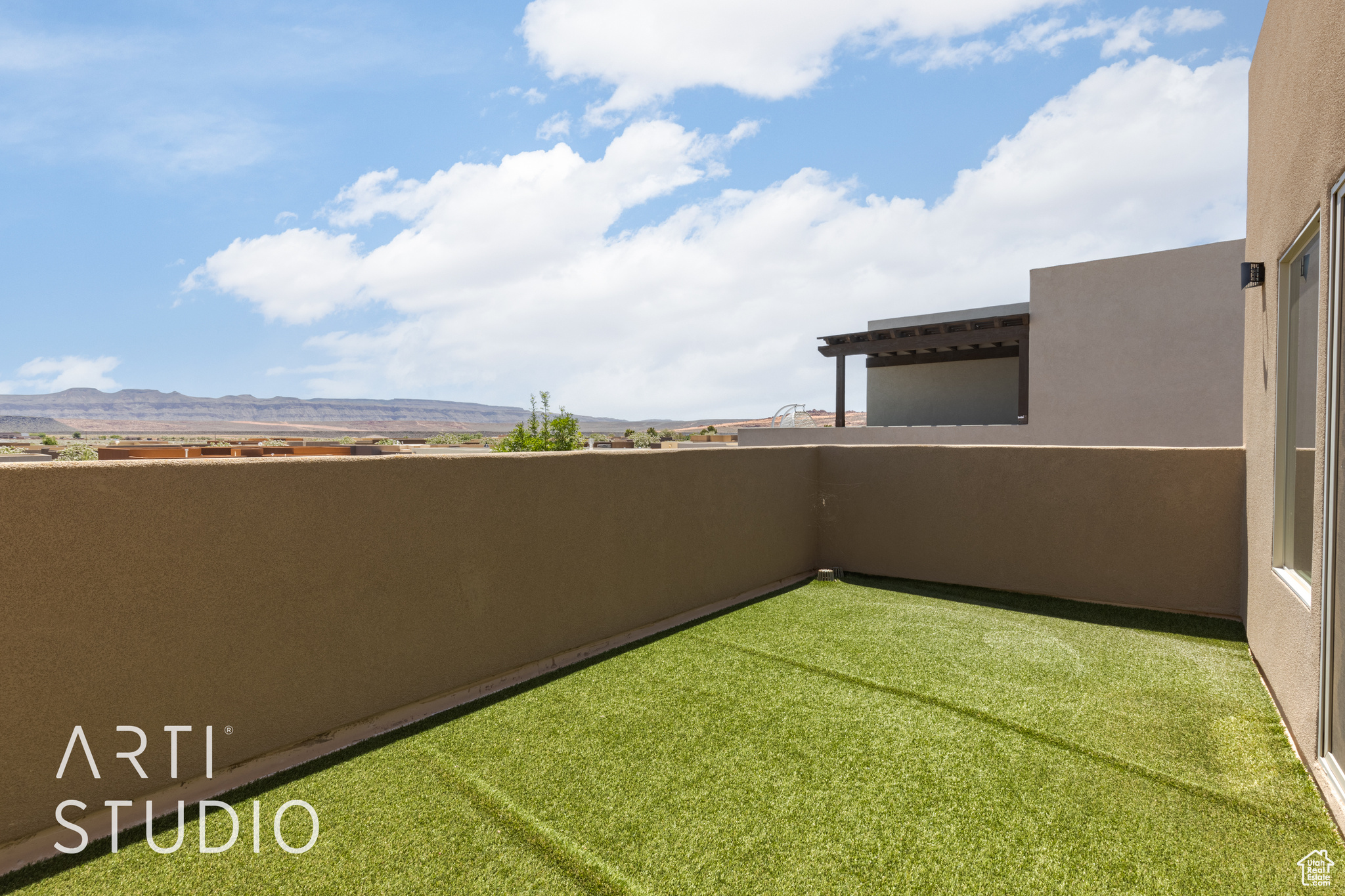 East View of yard featuring a mountain view and a balcony