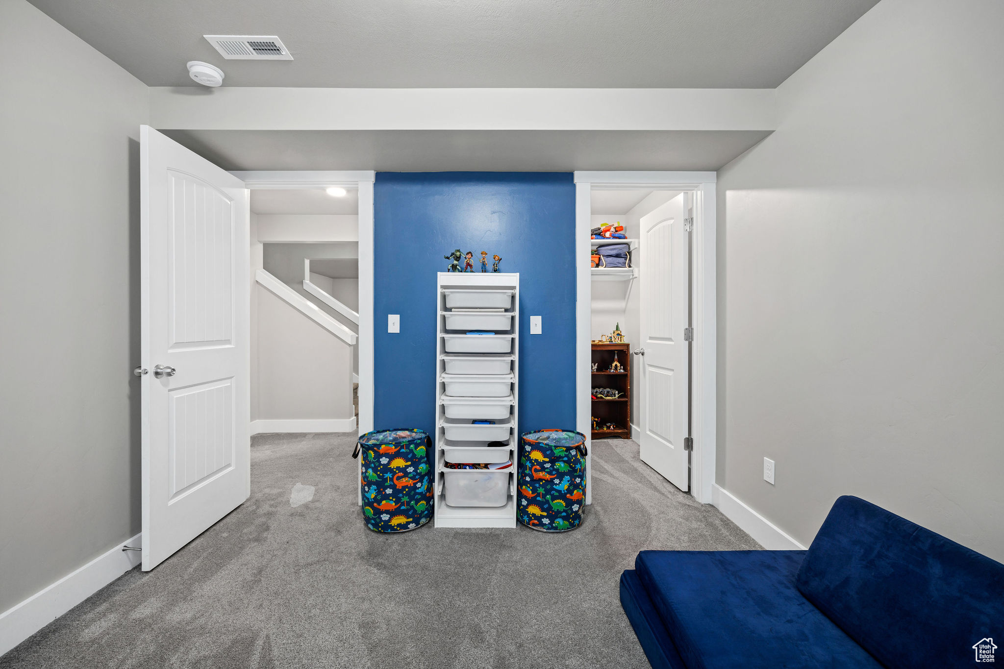 Carpeted bedroom with closet