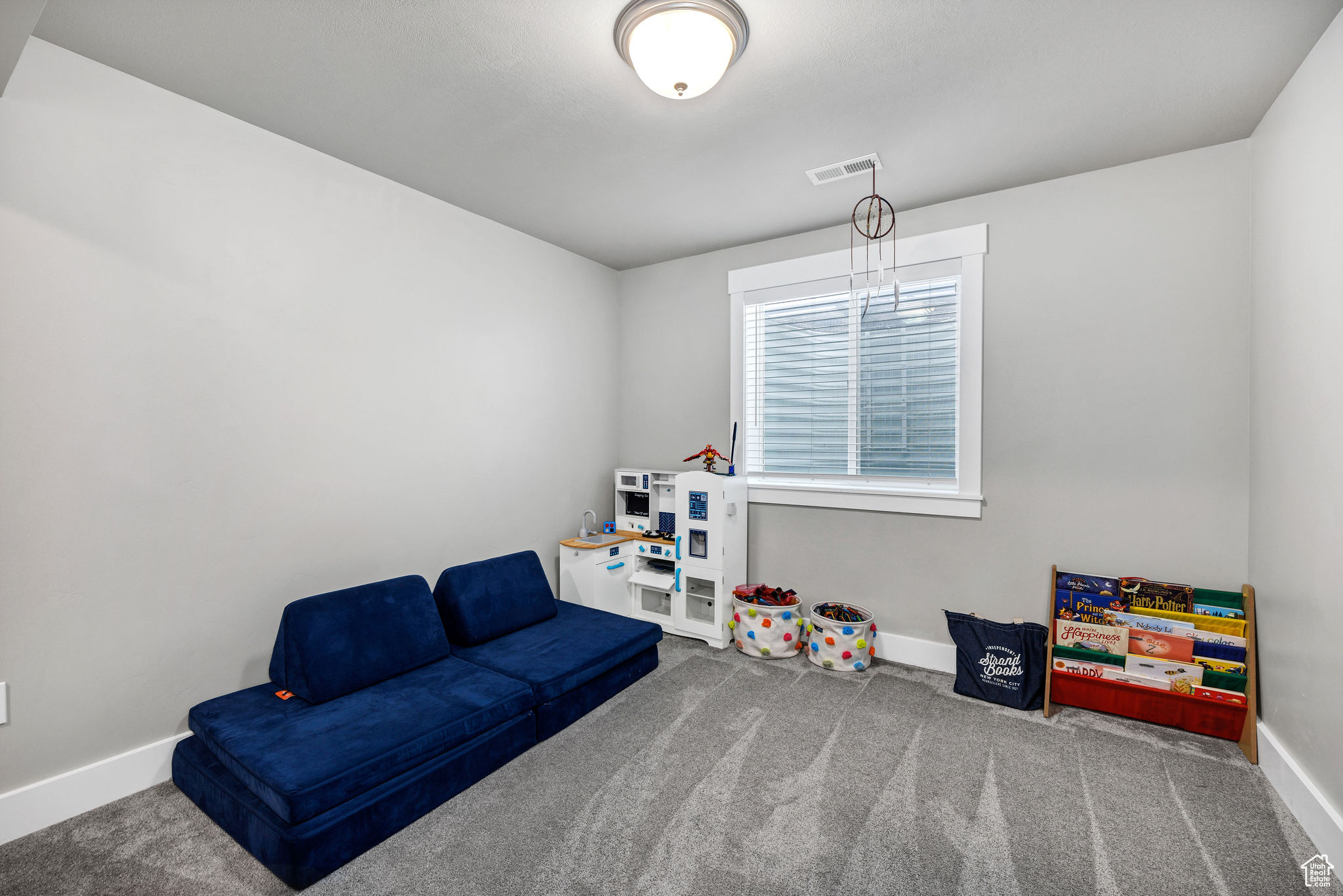 Carpeted bedroom with closet