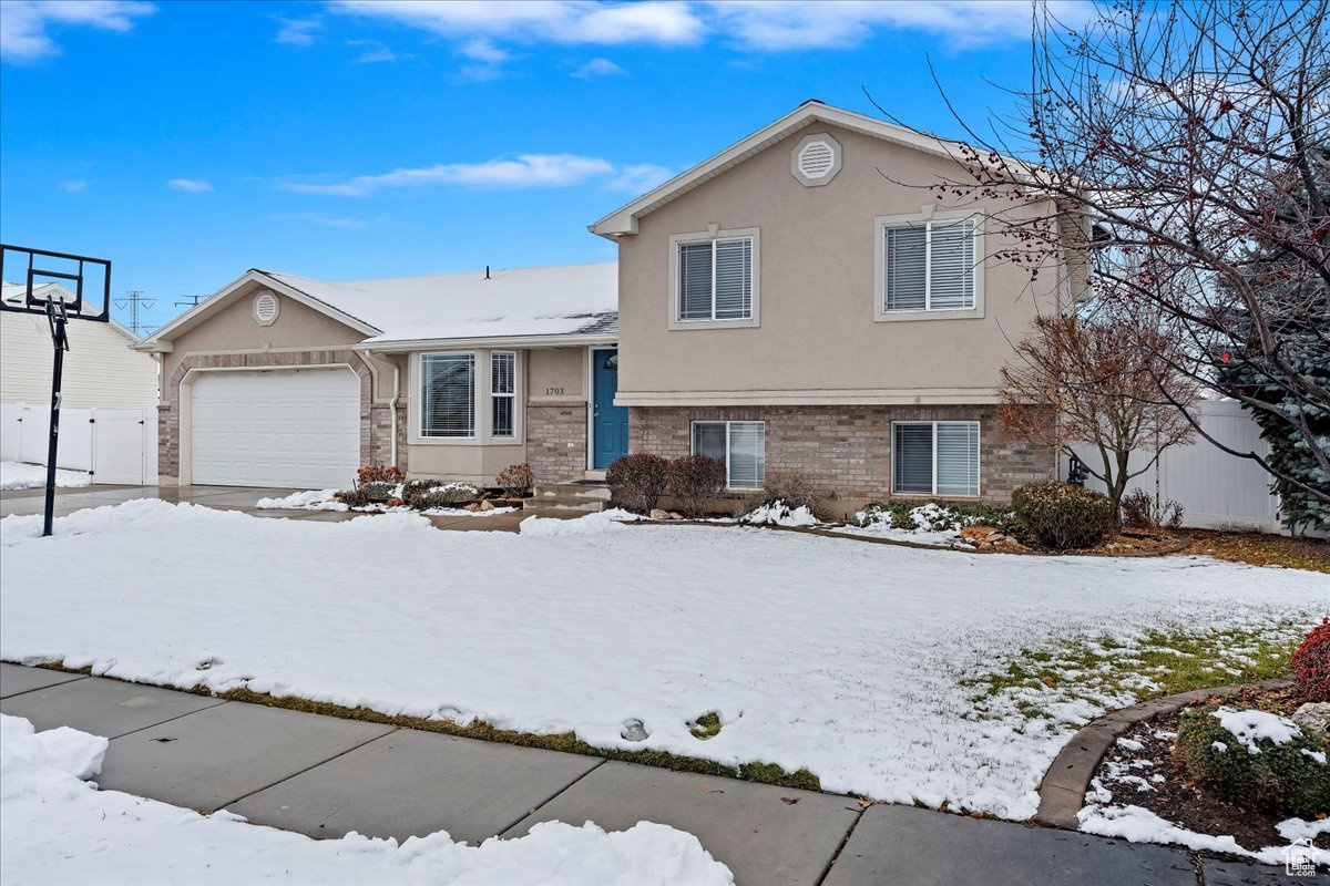 Split level home featuring a garage