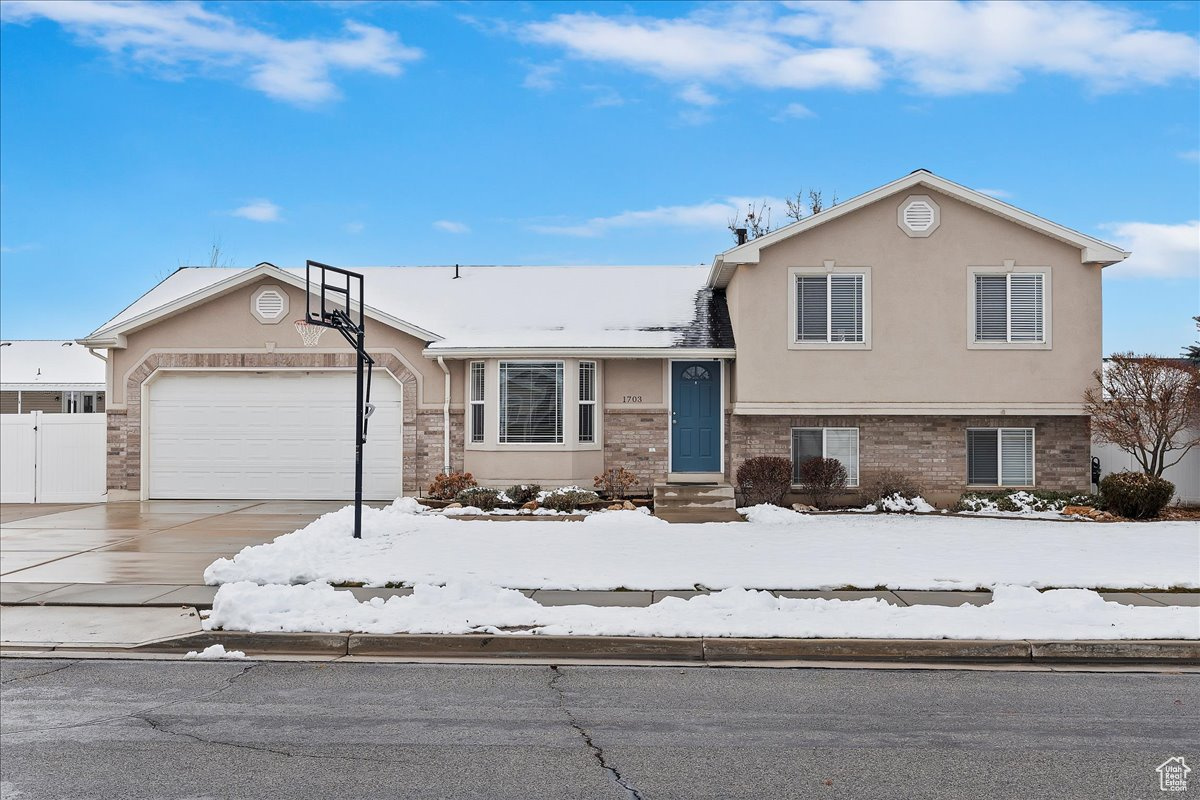 Split level home featuring a garage