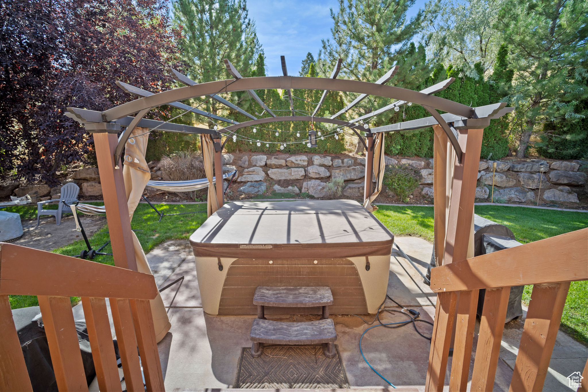 View of patio / terrace with a hot tub