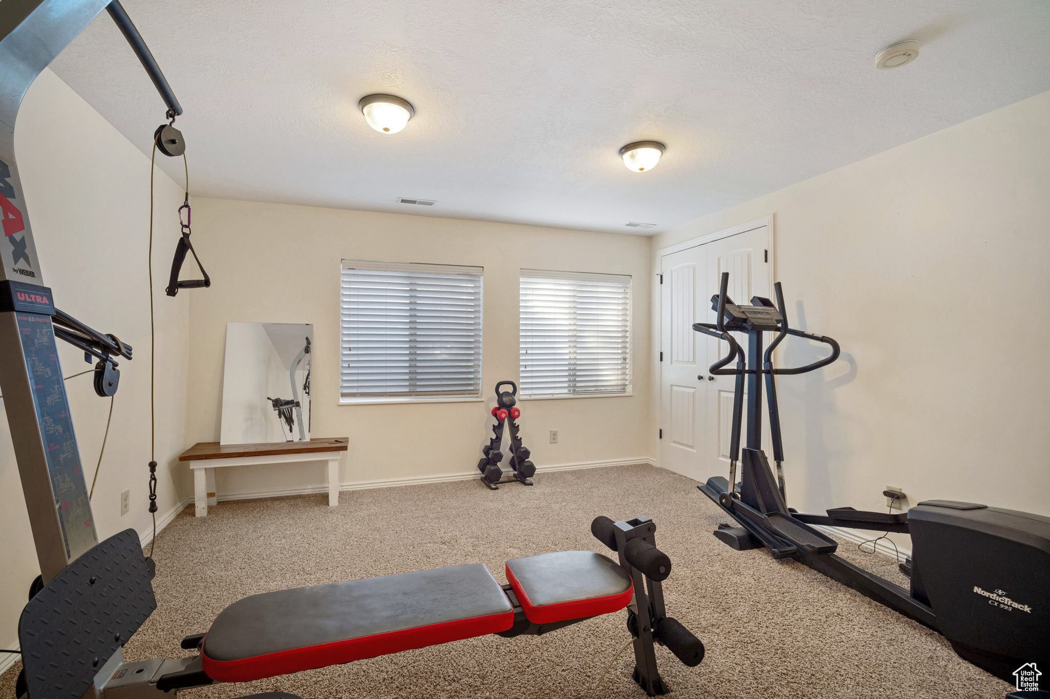 Exercise room featuring carpet flooring