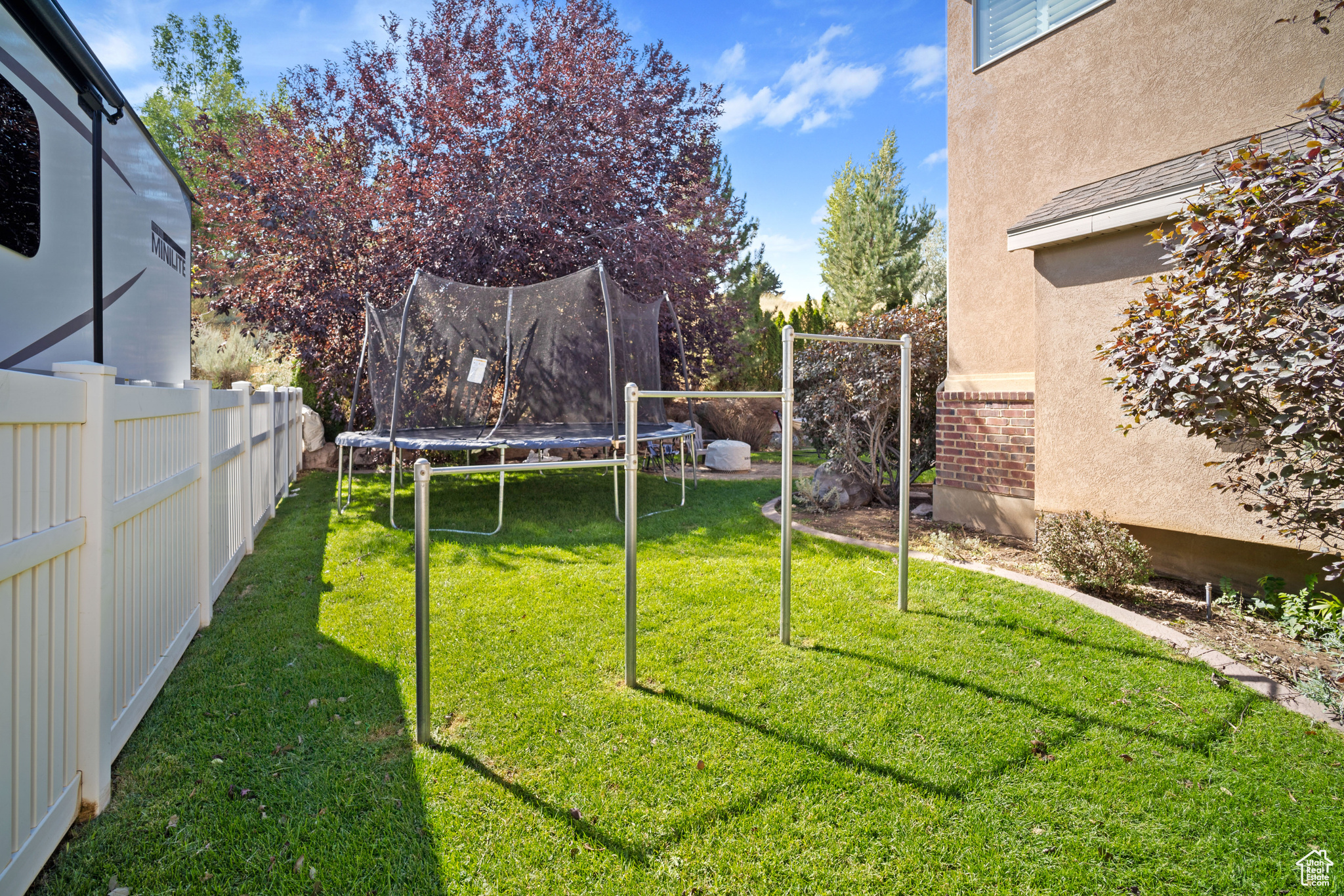 View of yard featuring a trampoline