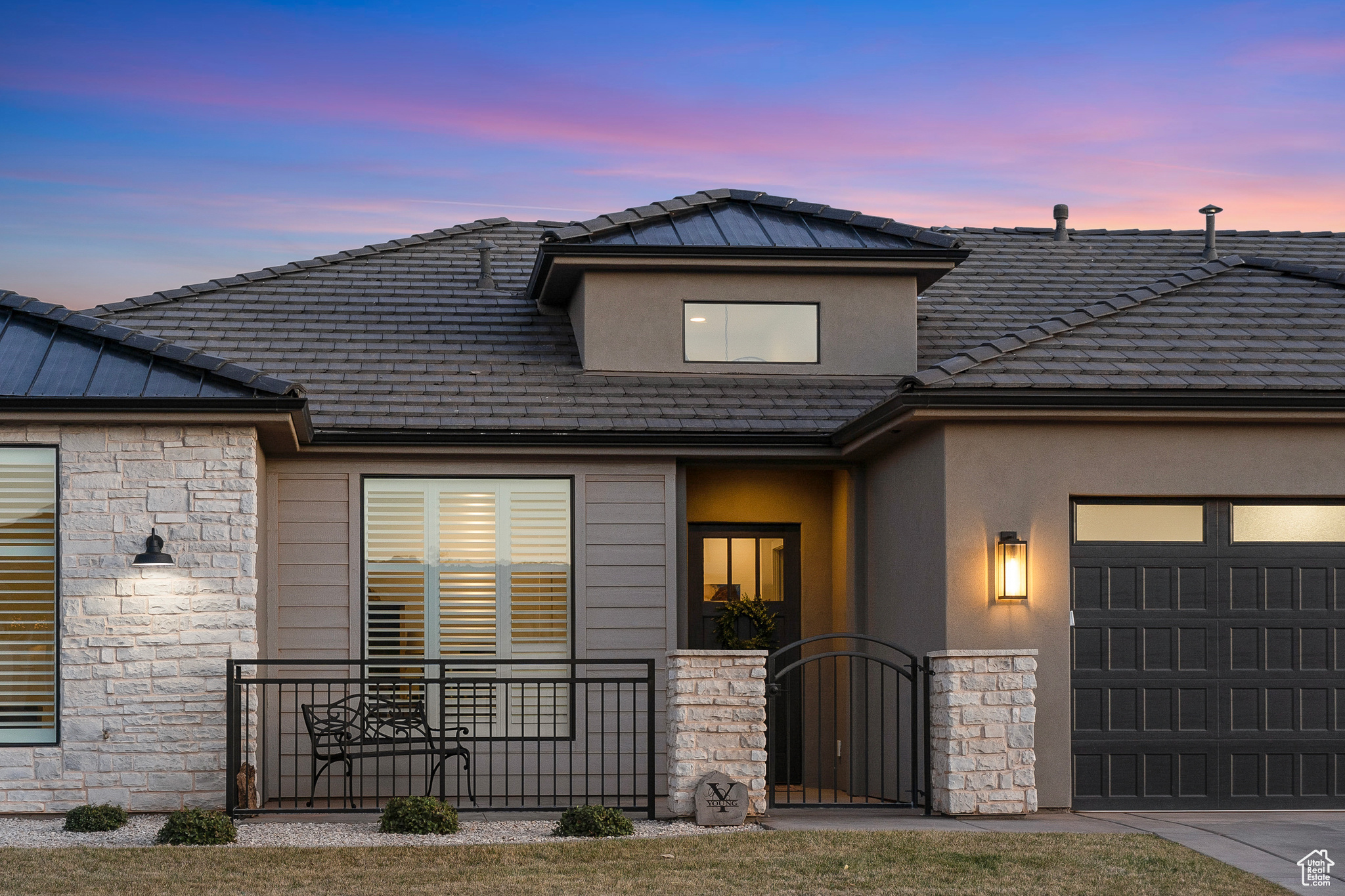 View of front of house featuring gated courtyard with mountain views